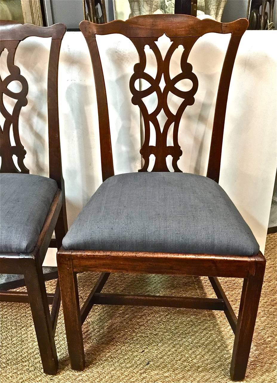 Two George III Chippendale chairs, circa 1770-1780. This assembled set Two period George III chairs are in overall very good condition and retain all of their original elements, including seat frames. One chair has a very old 