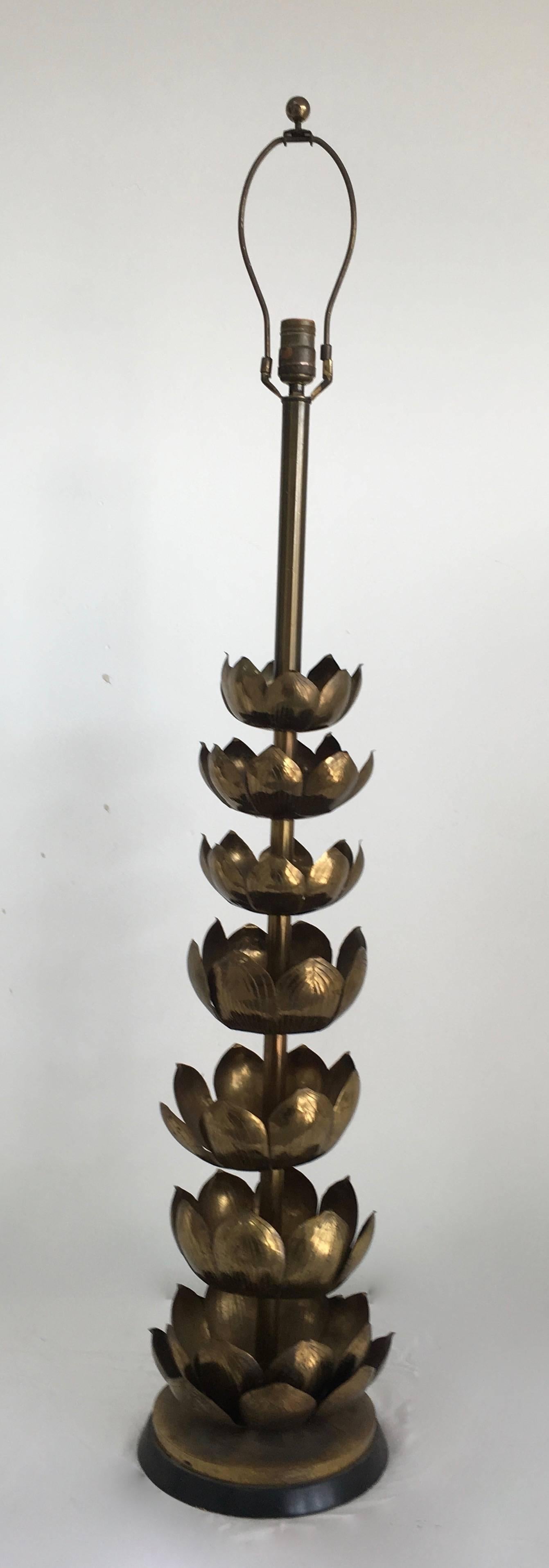 The Feldman brass lotus lamp floats seven-tiers of Lotus creating a lamp that not only stands on it's own, but can be utilized on a table or shelf, yet can also be used as a floor lamp.
Shade featured is not perfectly fitted, but we can customize