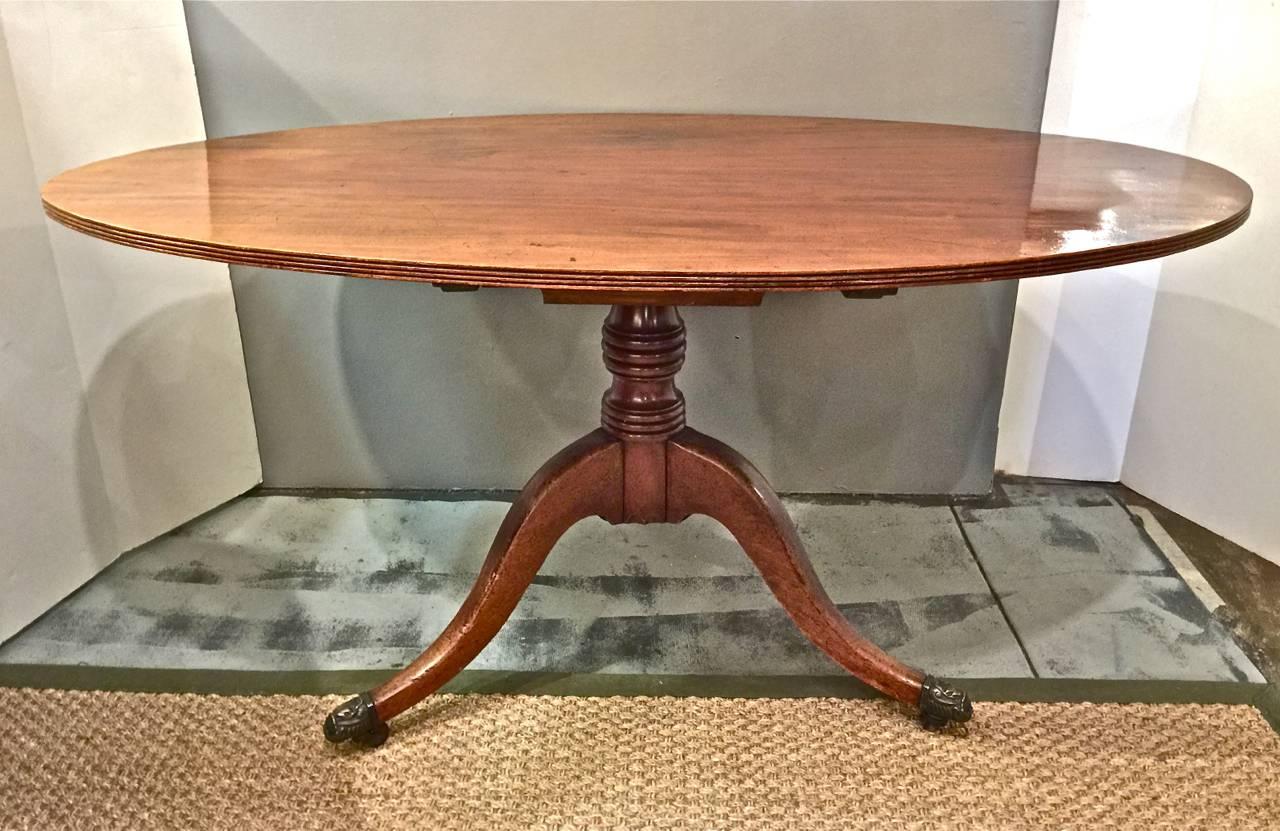 Period English Regency mahogany tilt-top breakfast table, circa 1820-1830.
This tables features a double board mahogany top and a three splayed leg support. The surface is old and has acquired a wonderful natural patina.