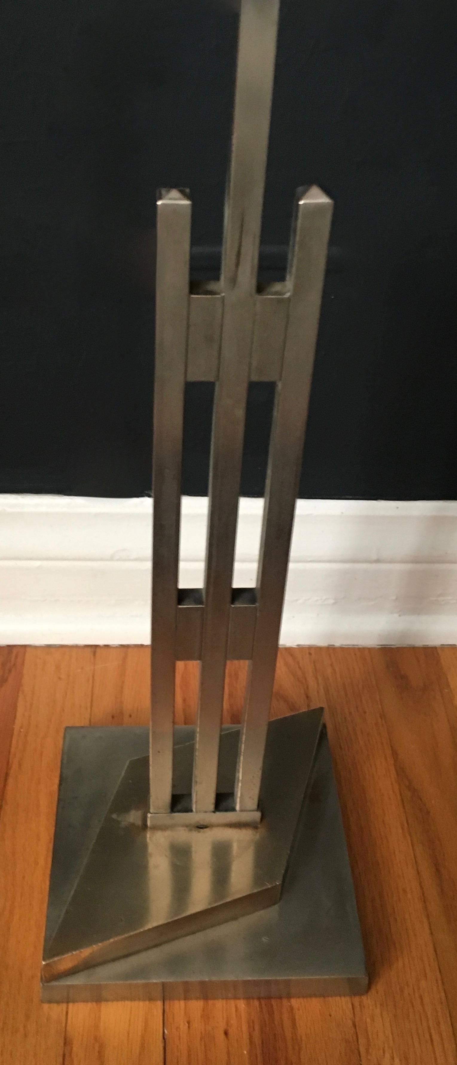 Handsome vintage adjustable Art Deco valet stand - most likely utilized for display purposes in a fine department store.

The stand is beautifully made of steel with brass details on the bottom - uniquely designed with thoughtful attention. The