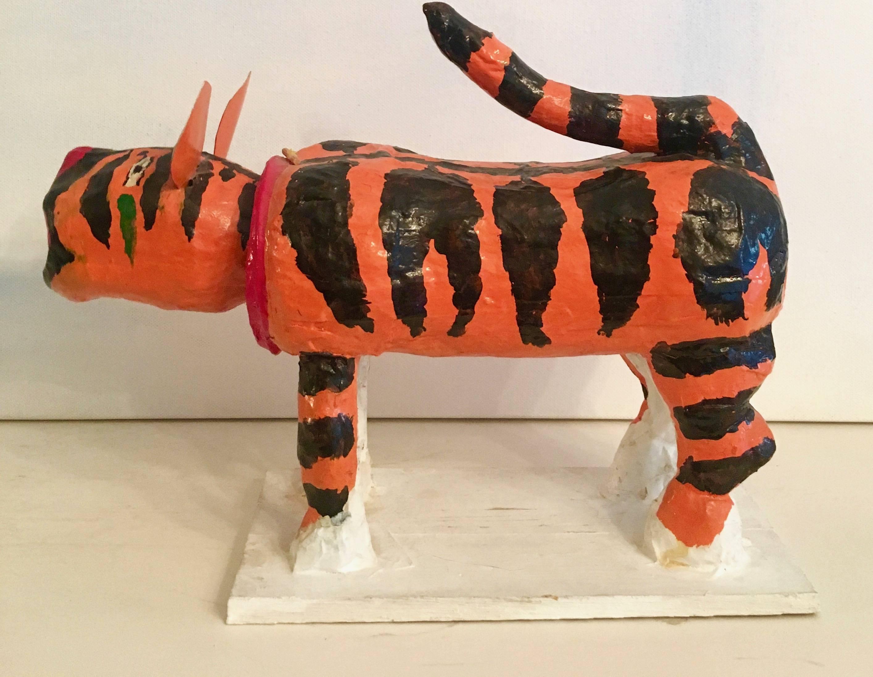 Japanese papier mâché lion is an empeccable display of stunning Japanese Folk Art. The vibrant orange colored lion not only speaks volumes through size and design, but his head Bobbles! a handmade piece sure to create, not only a great look for any
