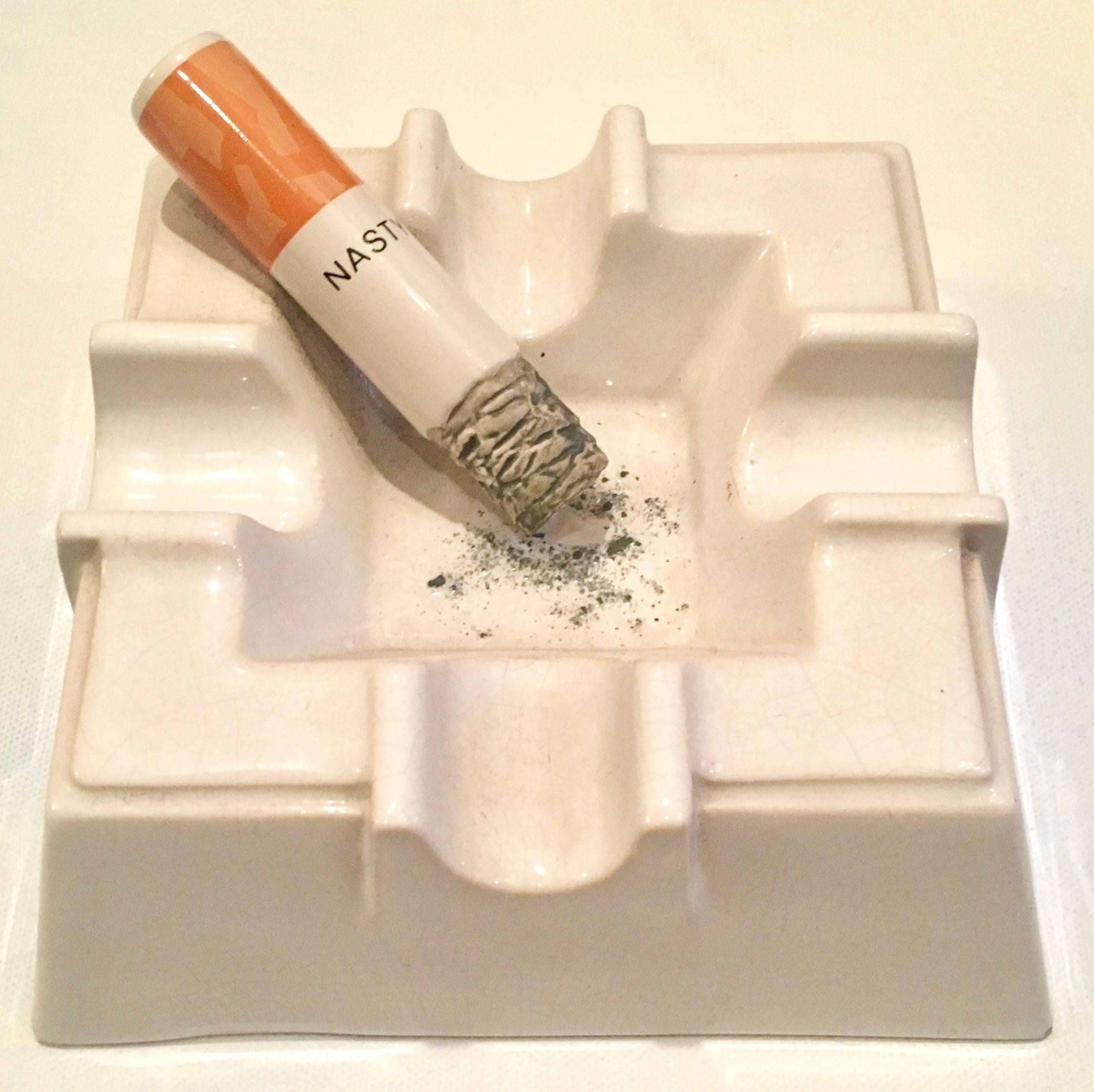 Sculptural ceramic ashtray from England can be used as an ashtray but we prefer to think of this as a play on the pitfalls of smoking! Time to Light up your favorite 420 Marijuana Cigarette! 

The cigarette and ashes are part of the design and