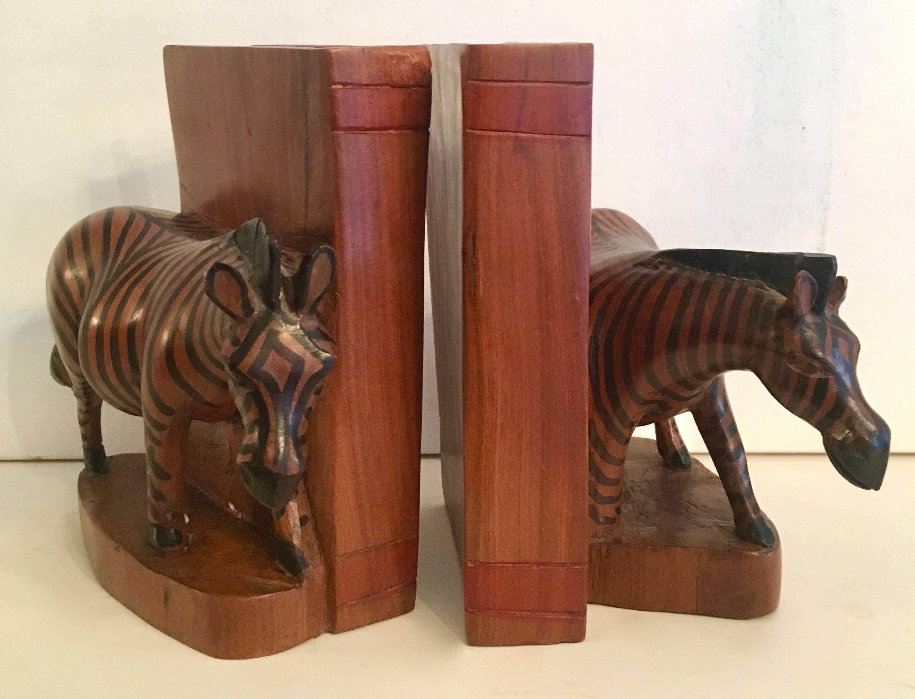 Custom and hand-carved Kenyan bookends with exceptional three dimensional Zebra's flanking a large carved wooden book. Great for any den or Childs room.