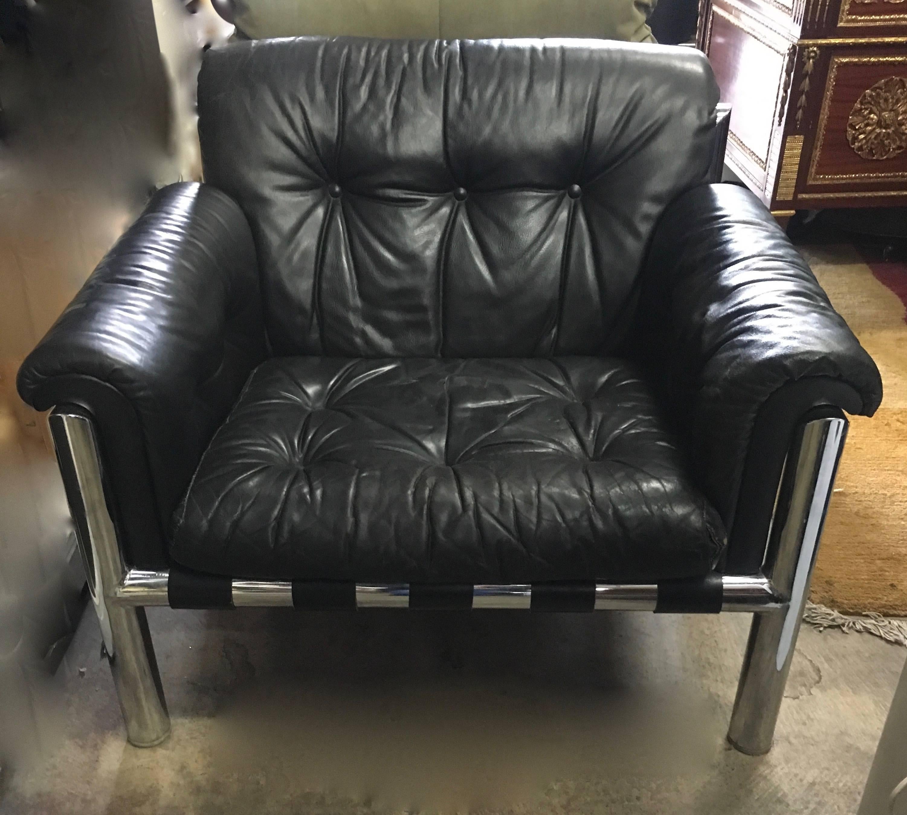 Pair of leather lounge chairs - wide and deep = comfortable. With chrome frames, this pair from the 1980s are both stunning and comfortable and in terrific vintage condition.