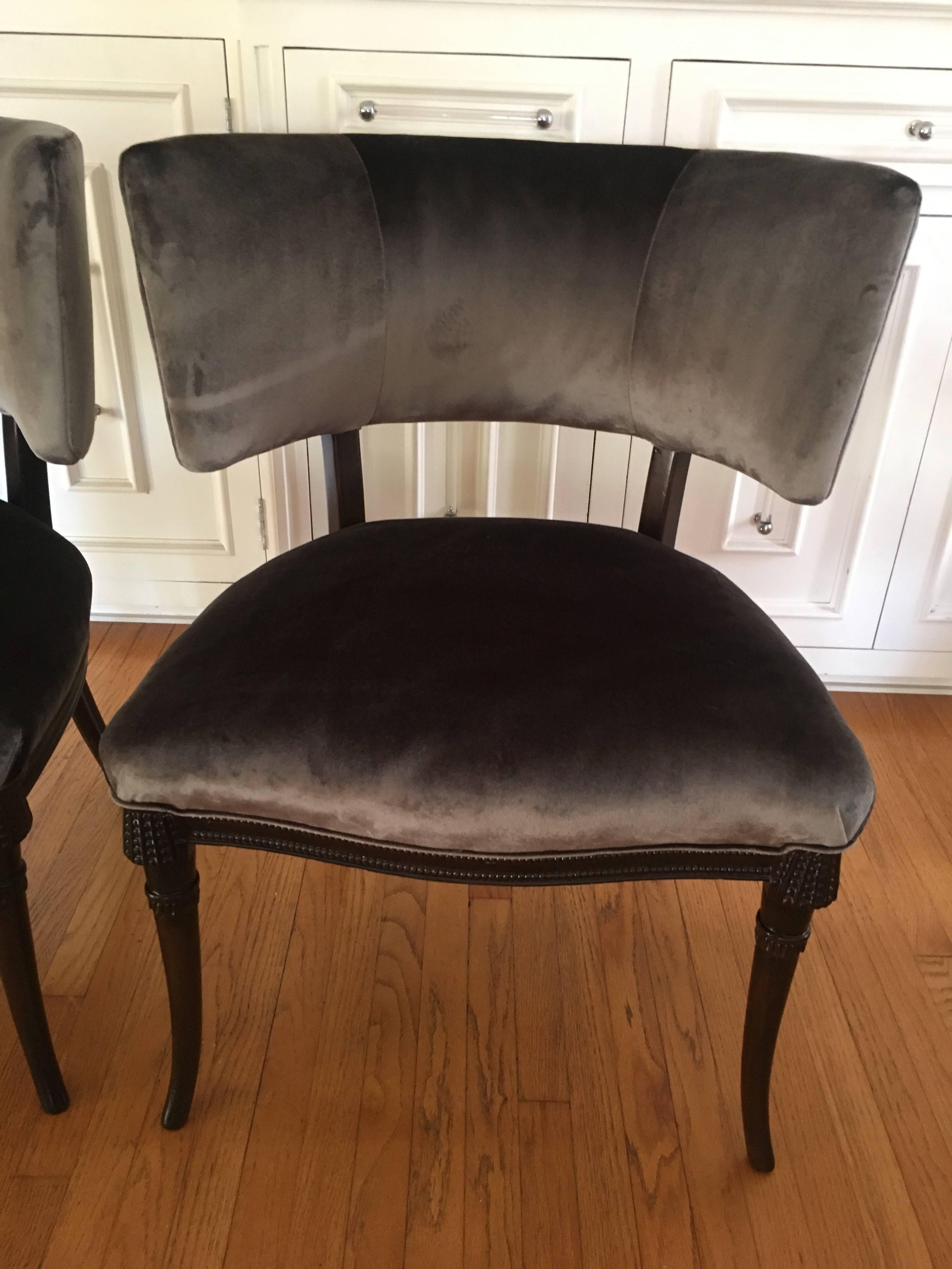 Completely refinished and upholstered Grosfeld house chairs done in walnut finish and grey belgian velvet.