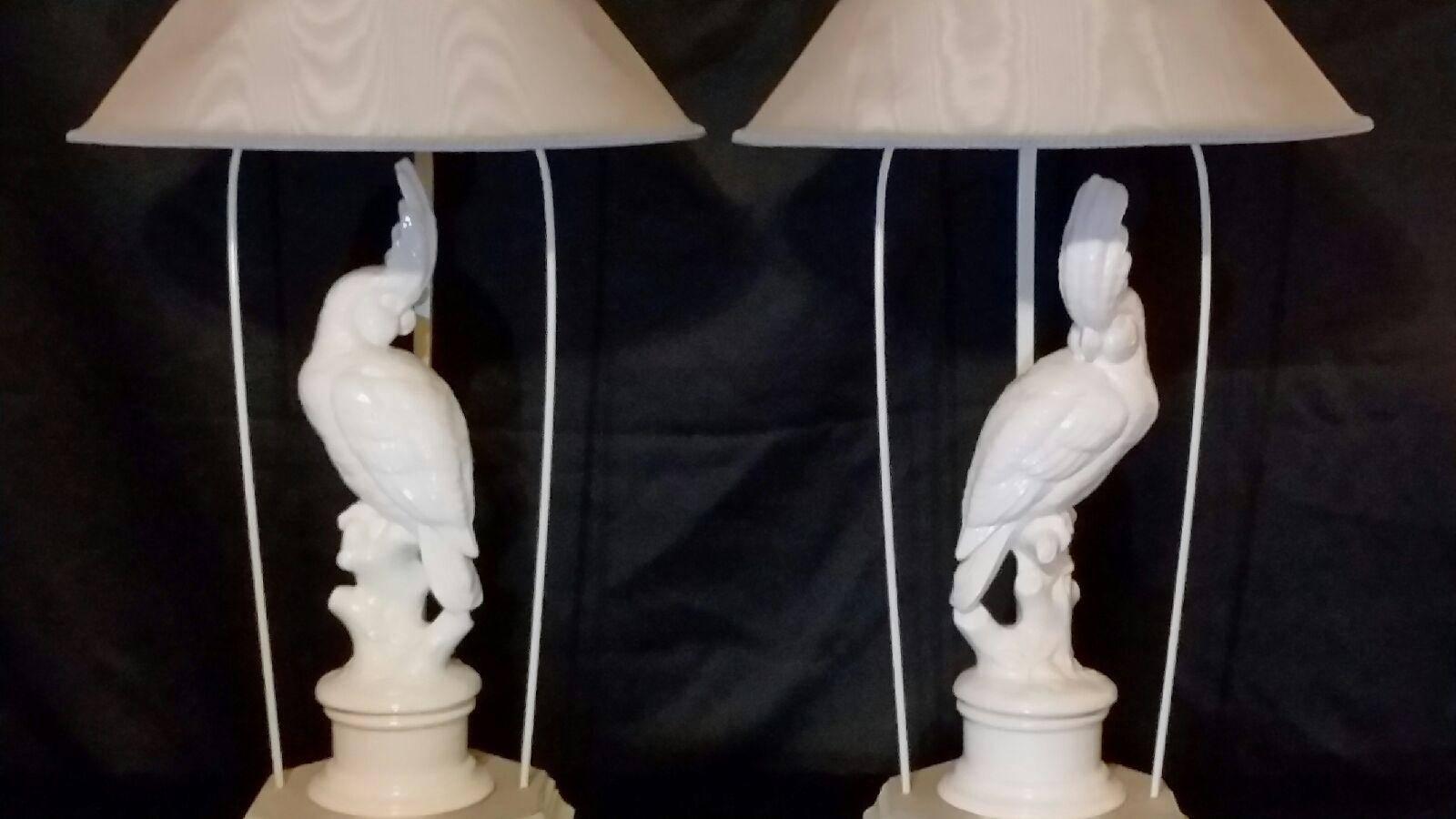 Striking pair of cockatoo table lamps with stylized finials and custom shades.

Shades: 19.5 diameter x 21 tall.