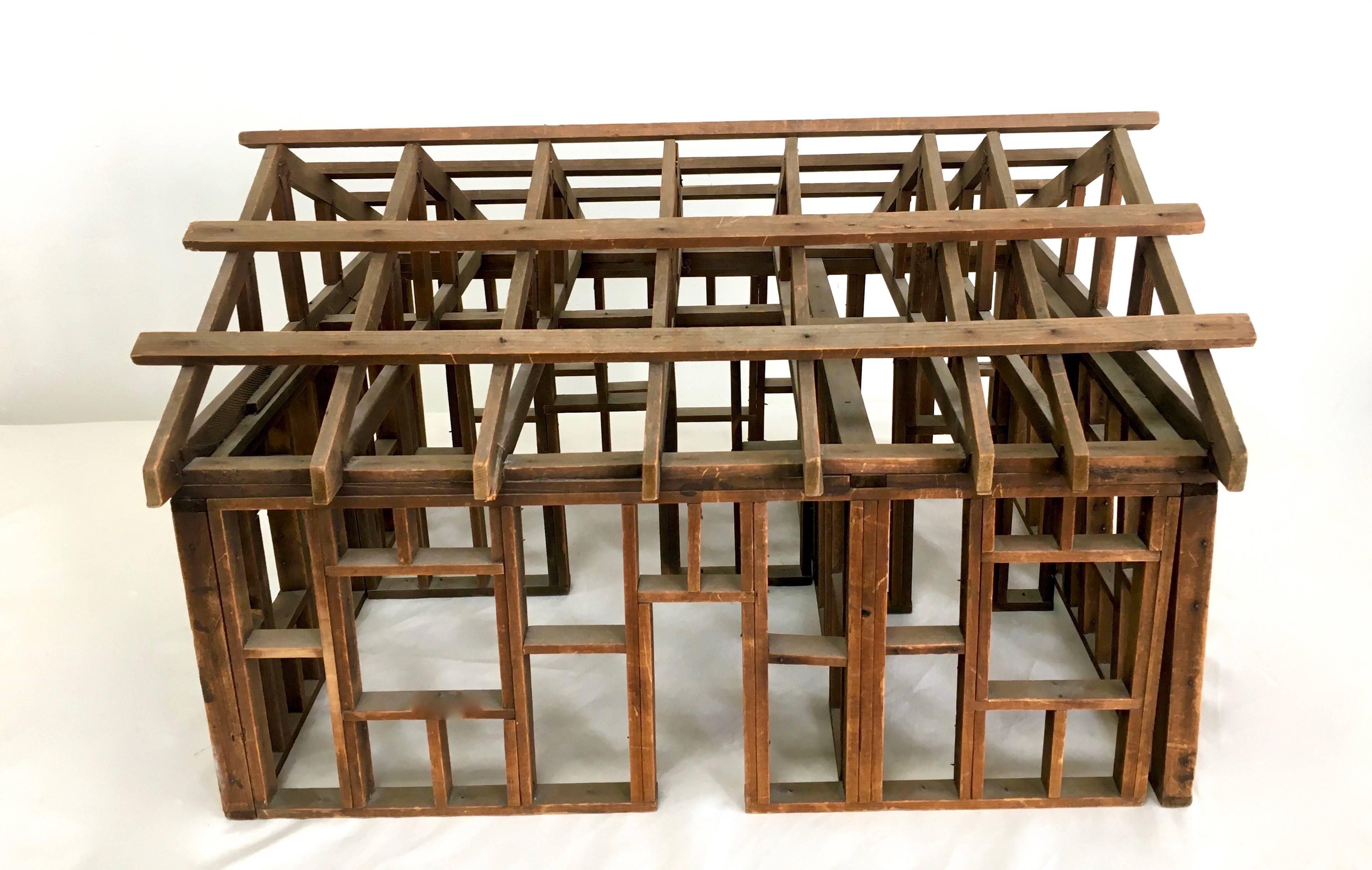 A Folk Art framework of a house. Simple, yet very sophisticated

The model, as a stand alone decorative structure, is a compliment to a large coffee or console table or perfect in a room near a light source to cast shadows on a nearby wall as a