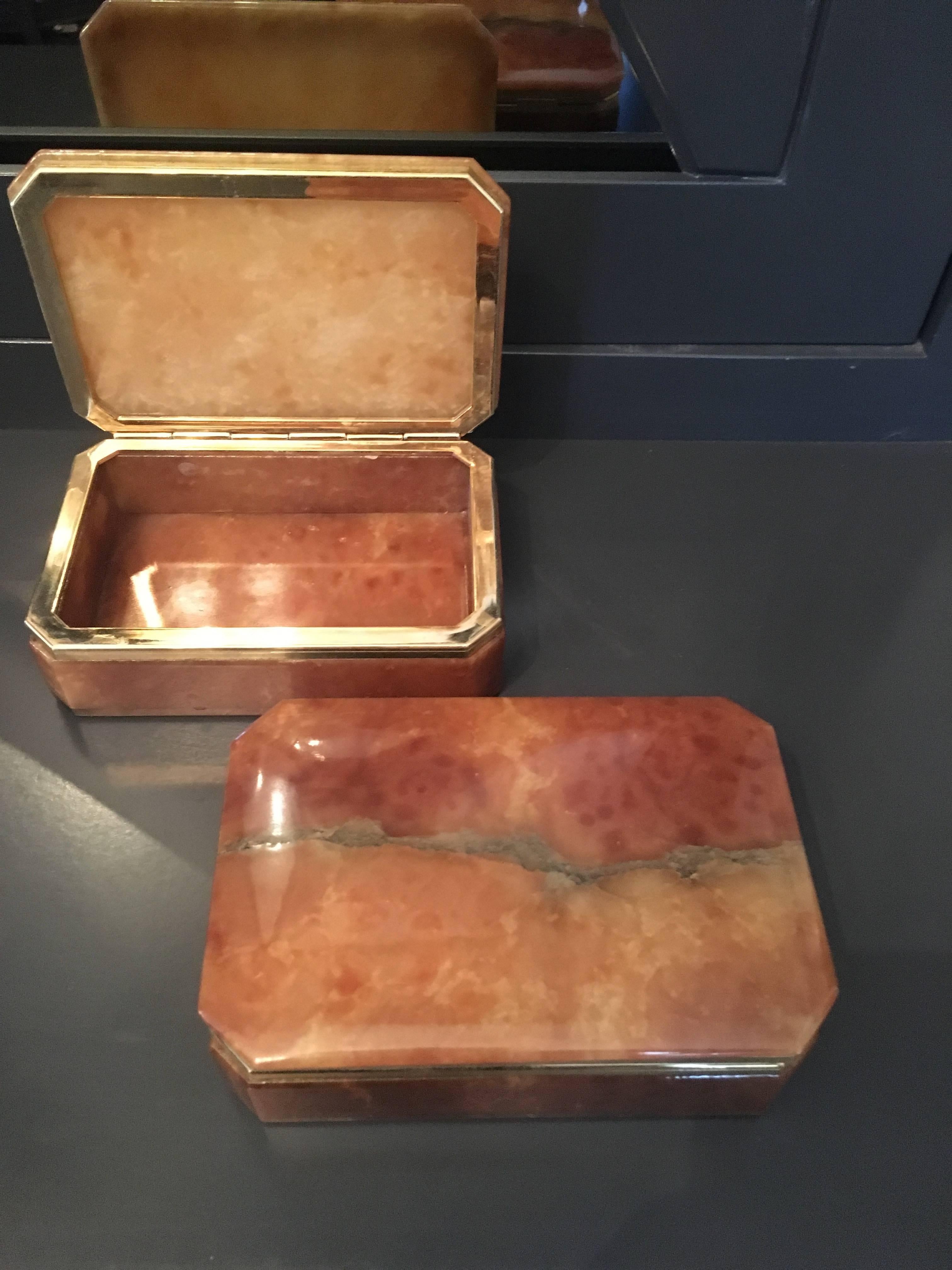 Pair of Italian alabaster boxes with brass trim - handsome on the dressing table or desk - see also our more feminine color boxes.

Darren Ransdell Design.