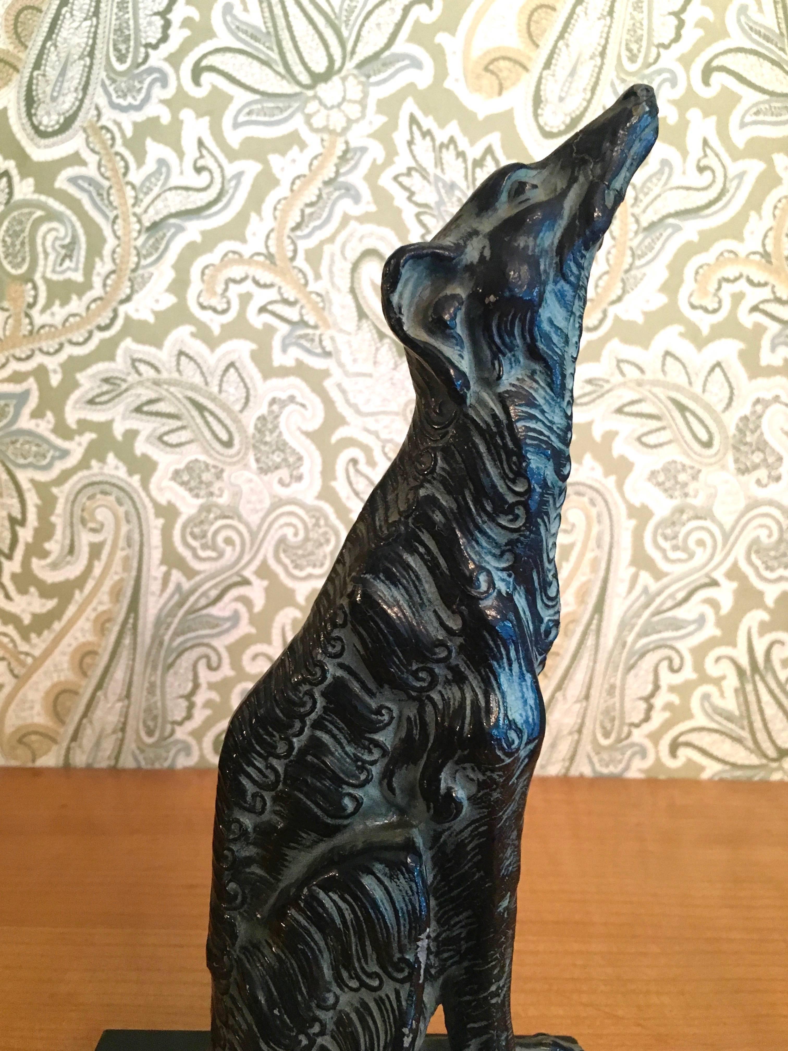 Metal sculpture of afghan Borzoi dog on marble stand. Beautifully made sculpture perfect for the dog, and especially Afghan lover mans best friend sits proudly on any shelf, or desk in any room!