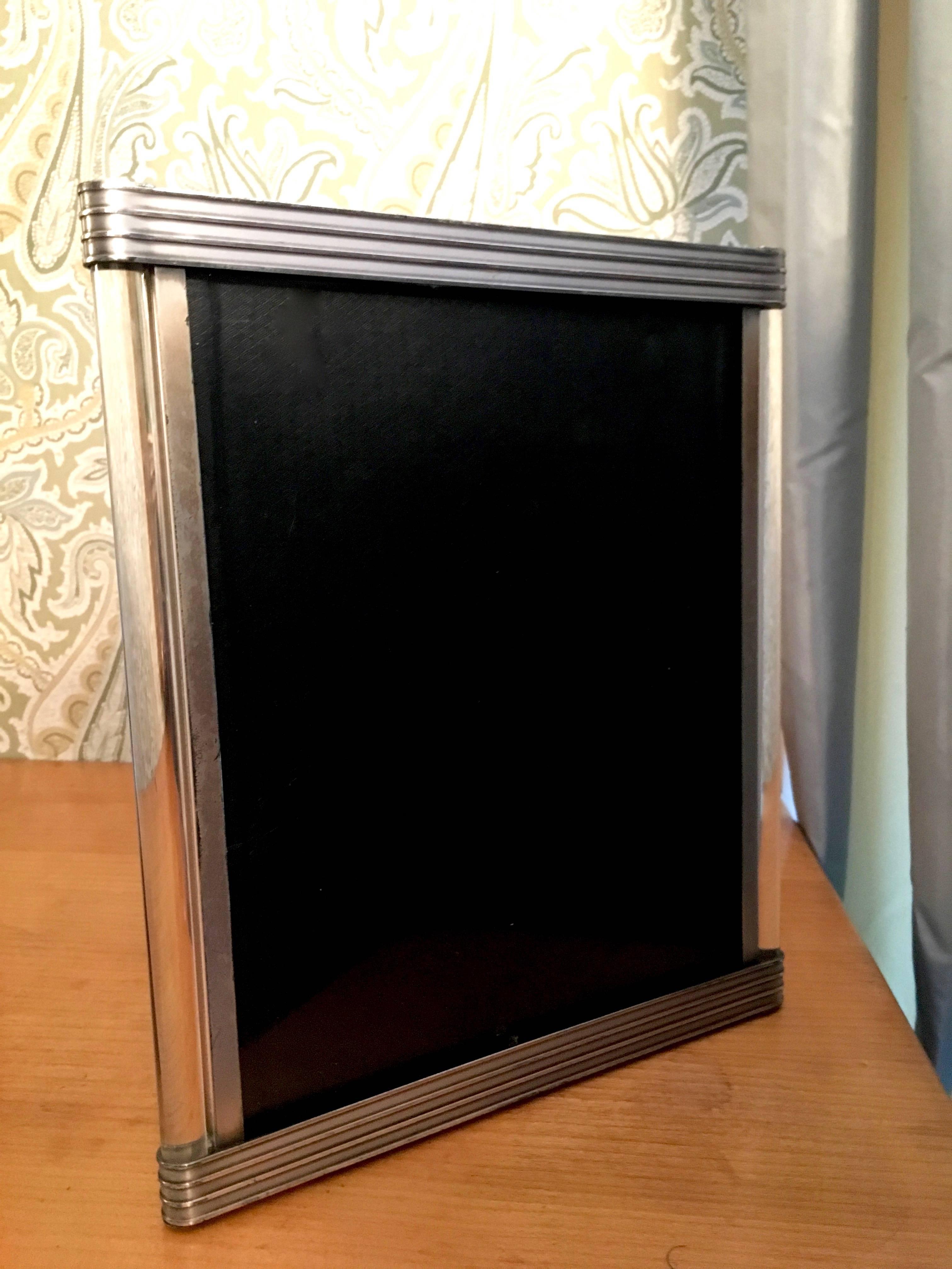 Art Deco measure: 8 x 10 picture frame with ribbed metal and glass rod details, a simple Art Deco style piece with a bit of age, and patina. The glass rods are in great condition. Darren Ransdell Design suggests a compliment to modern or vintage