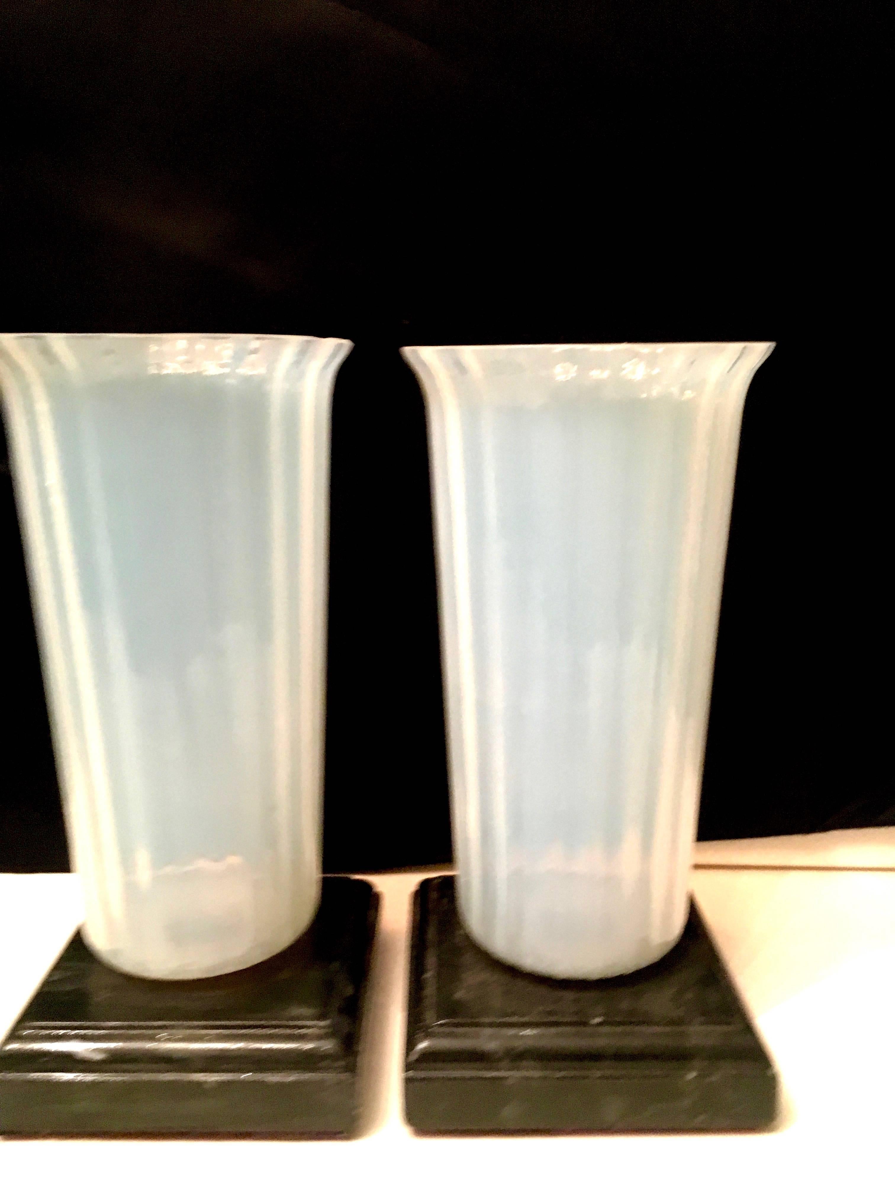 Pair of opaline Murano vases on marble bases a lovely compliment to any table mantel or shelf in mint vintage condition.

Darren Ransdell design.