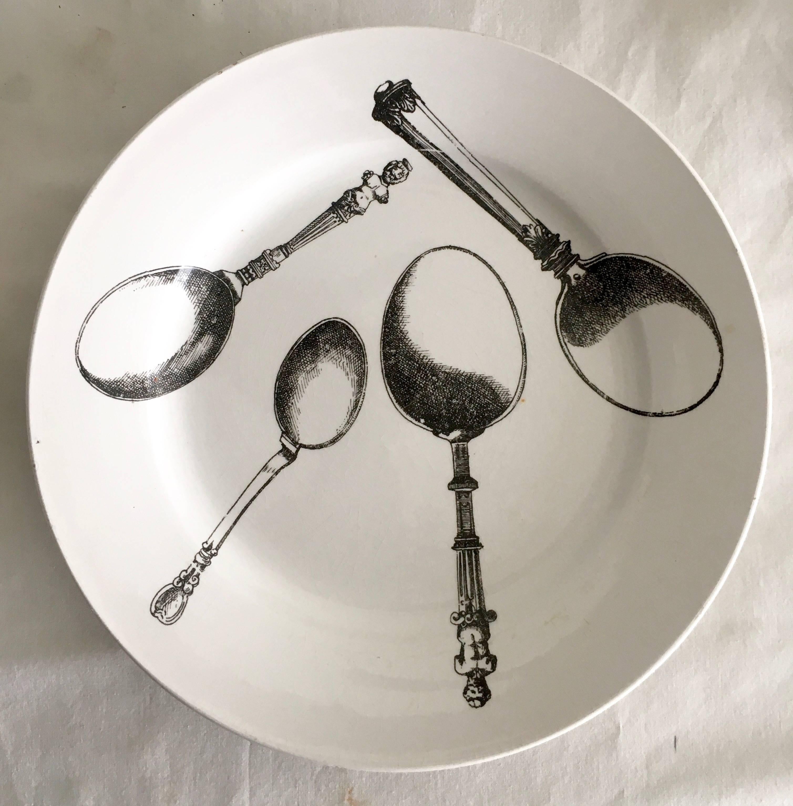 Pierro Fornasetti, never missing a genre. Pair of rare Fornasetti Italy plates with utensils, suitable for eating, decor or admiring.

