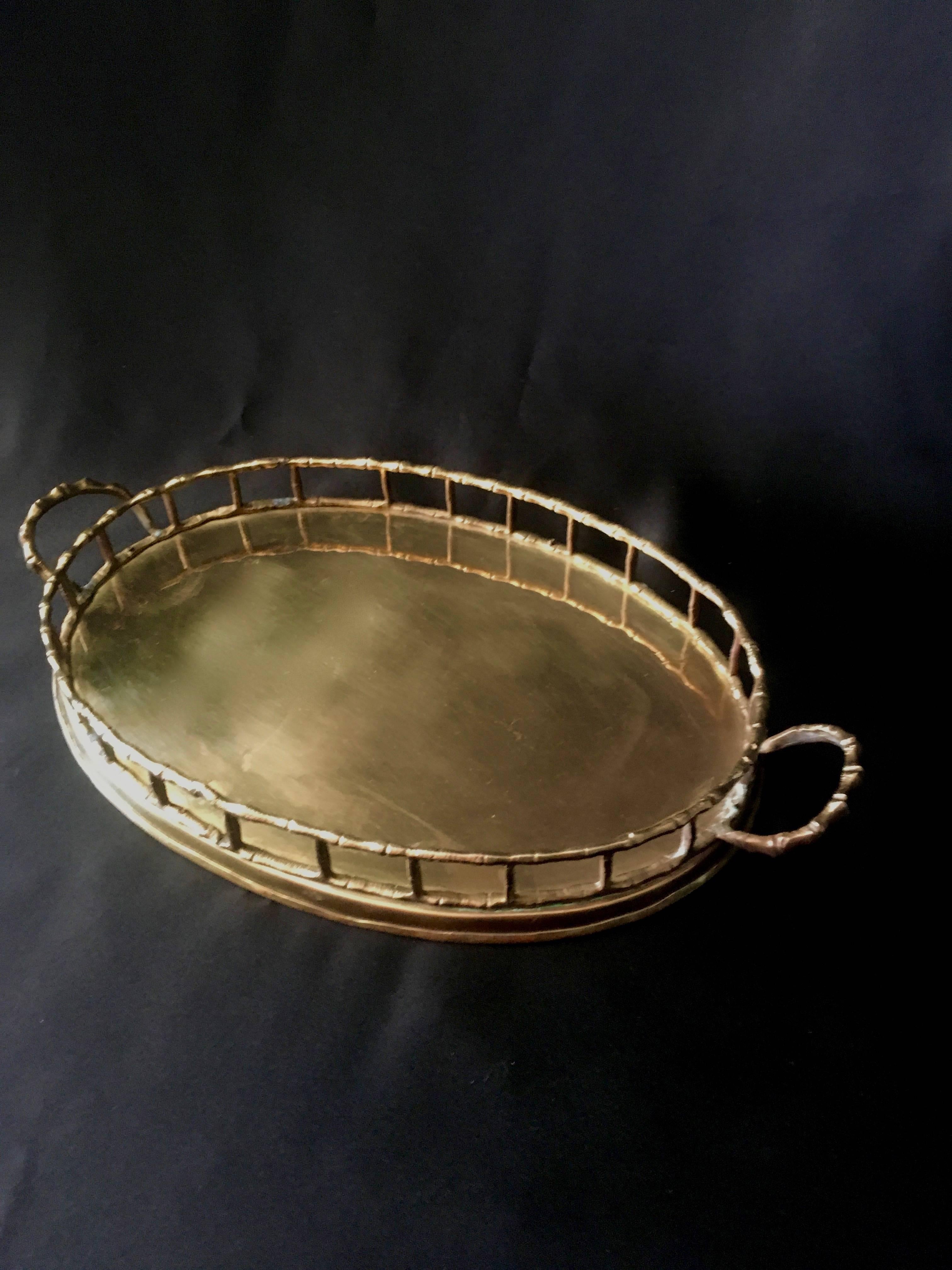 Small oval bamboo brass tray in the manner of Ralph Lauren

Perfect compliment to any side table in the living room or den - especially handsome in the bar area or mens dressing room or table.

We sell these trays to Ralph Lauren often - a