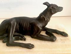 Bronze Sculpture of a Lounging Doberman