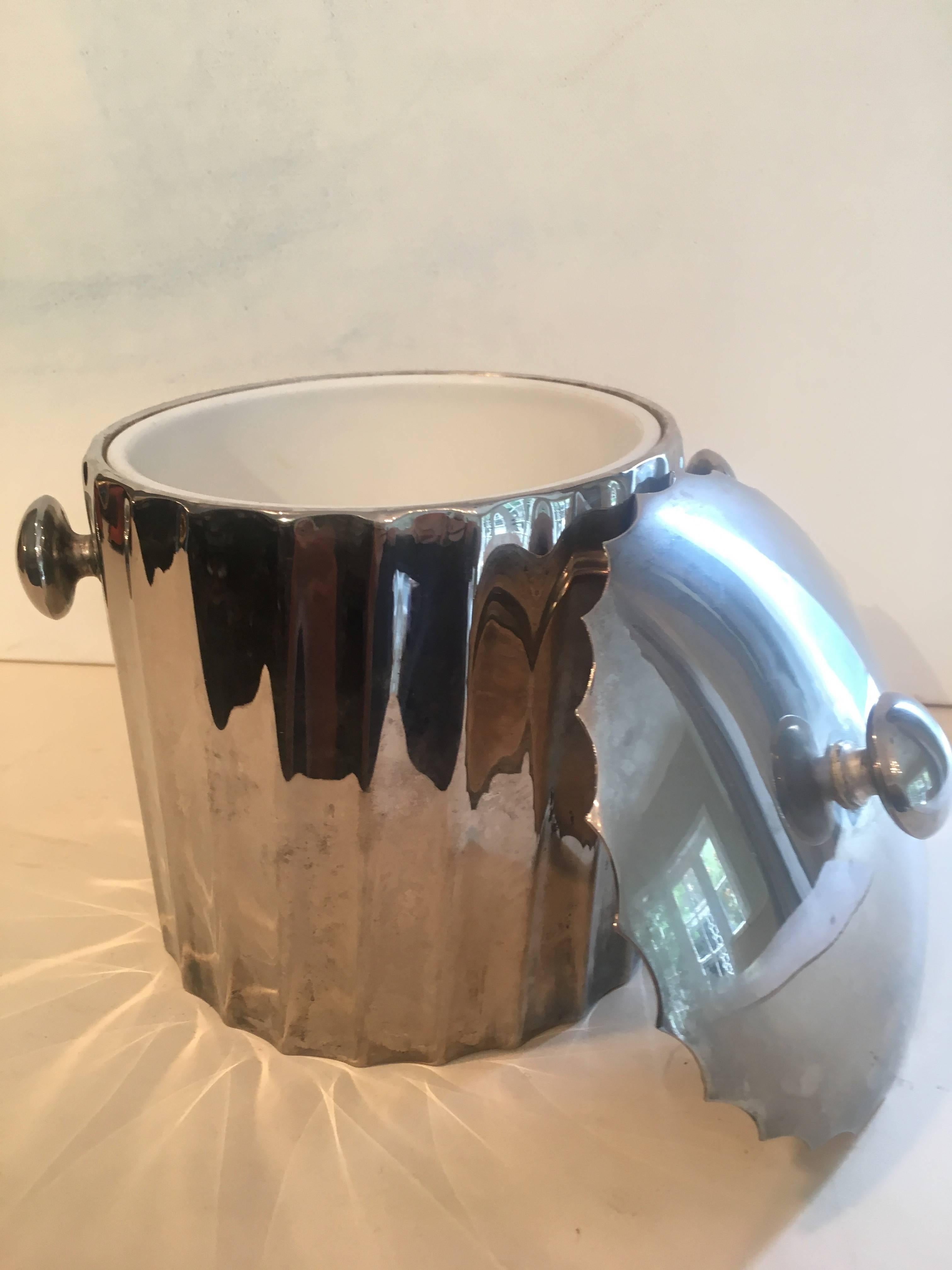 Silver Mid-Century small bar ice bucket.

Great for the bedroom or office bar, or just for those cozy small bar or bar cart.