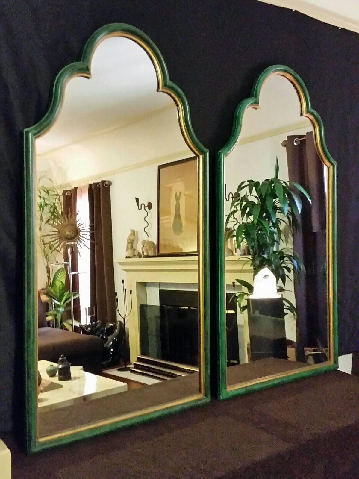 A striking pair of wall mirrors acquired from the famous La Valencia Hotel in La Jolla California after a recent remodeling project. Constructed out of wood with faux green malachite finish and gold detailed trim. True beauties.

The shape and