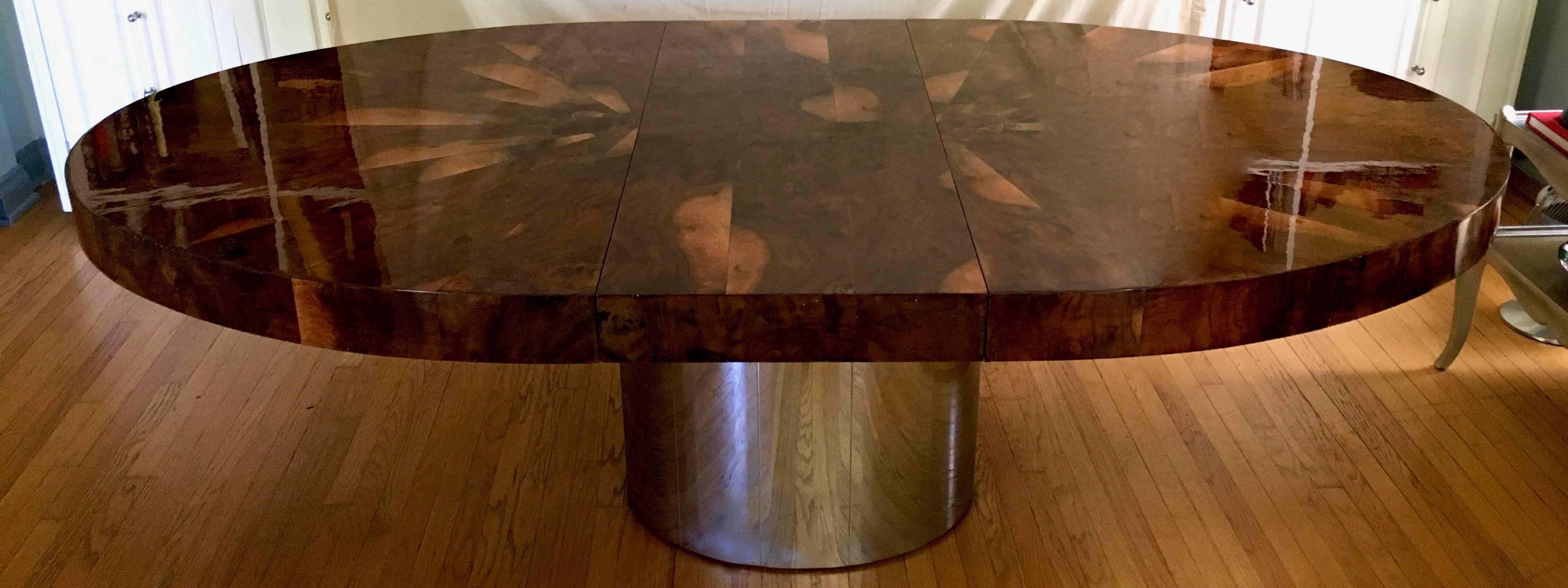 Iconic Paul Evan's dining race track dining table in dark matched burl top, with chrome base.

The dark burl and highly stunning polished top, while designed almost 50 years ago is very relevant and trending with today's color schemes and metal the