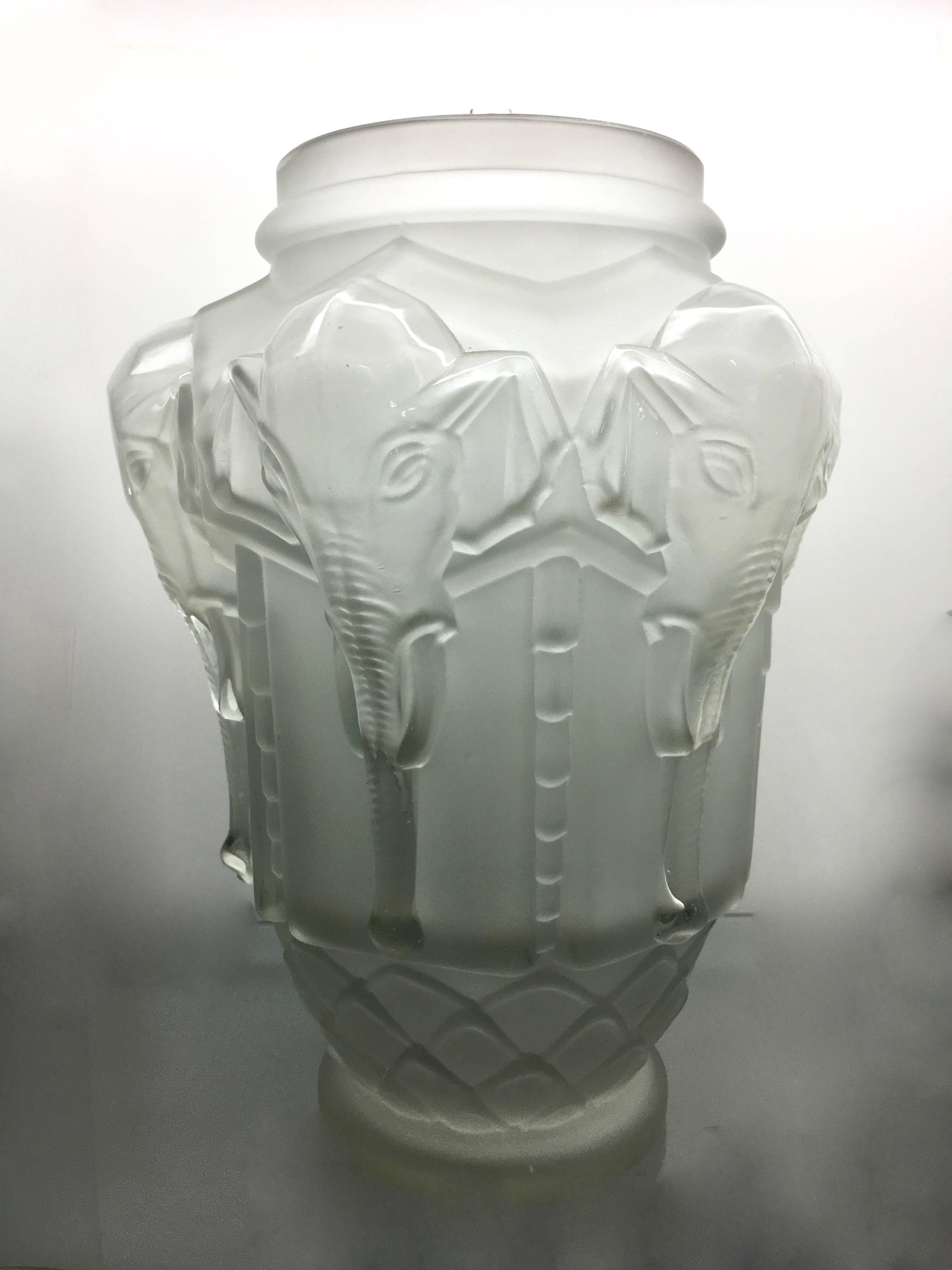 Frosted elephant Edmond Etling vase, after Lalique, circa 1930, a stunning vase, used as a lovely sculpture or filled with flowers is a compliment to any room.

With a design reminiscent of R. Lalique a stunning piece!