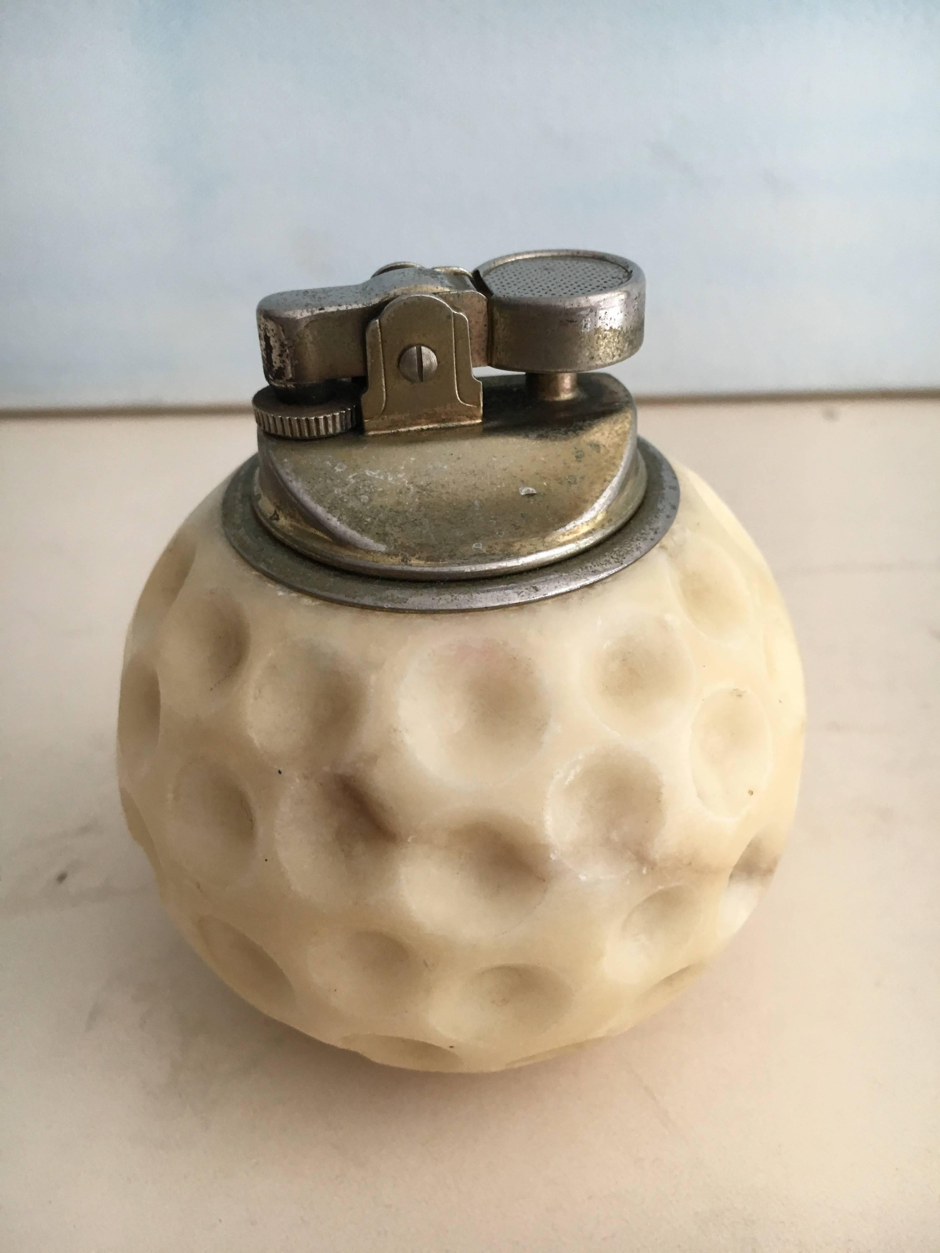 Vintage marble golf ball 420 cigarette lighter, perfect for the office or opium den!

Play 18 holes and then, relax!

See Darren Ransdell designs other great golf pieces on the site.