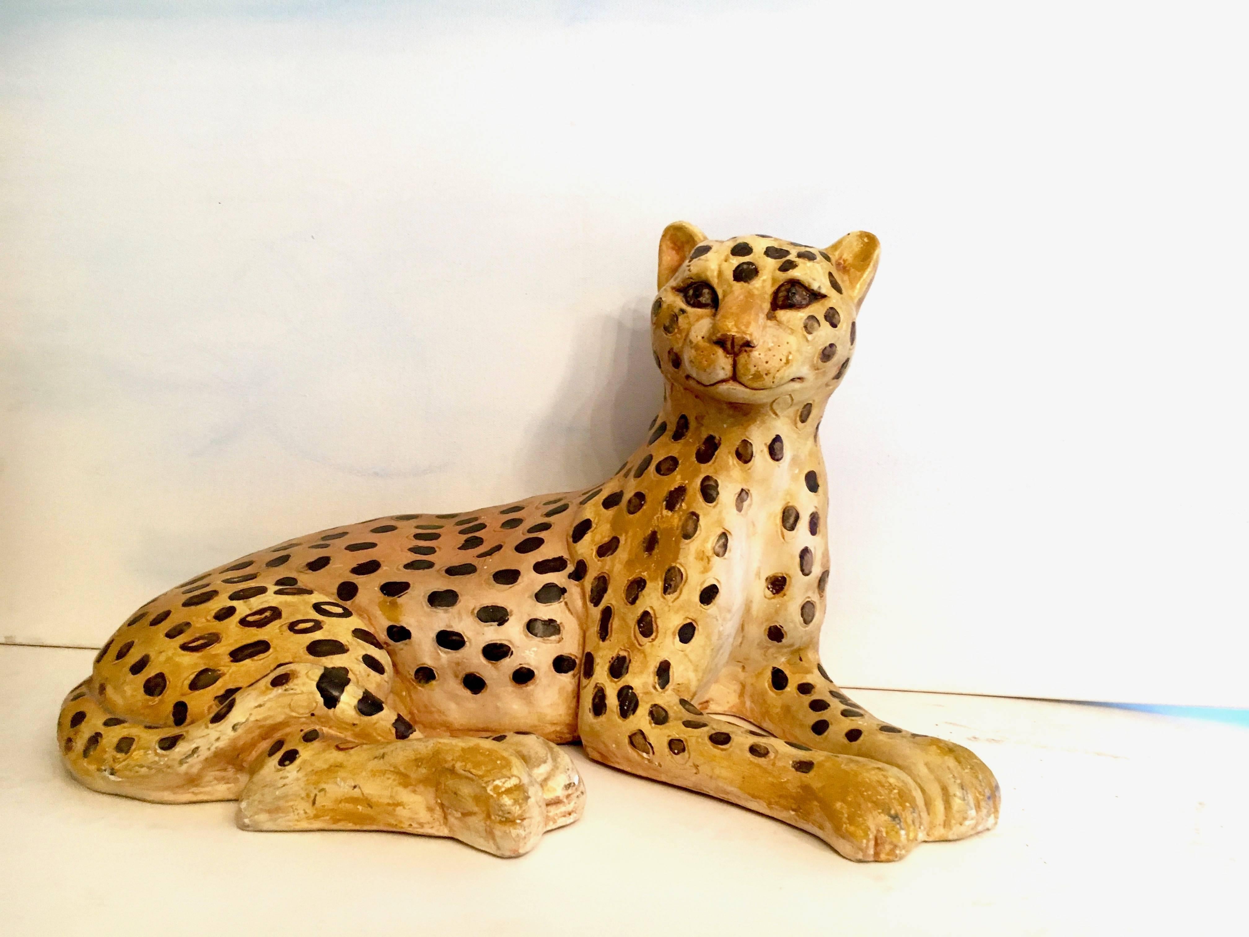 Vintage plaster sculpture of a Lounging Leopard - a midsize piece that will compliment any corner of the house, or lounging under a console, table or childs room - or on a high shelf?

This cat is a great piece and will add with it's uniquely