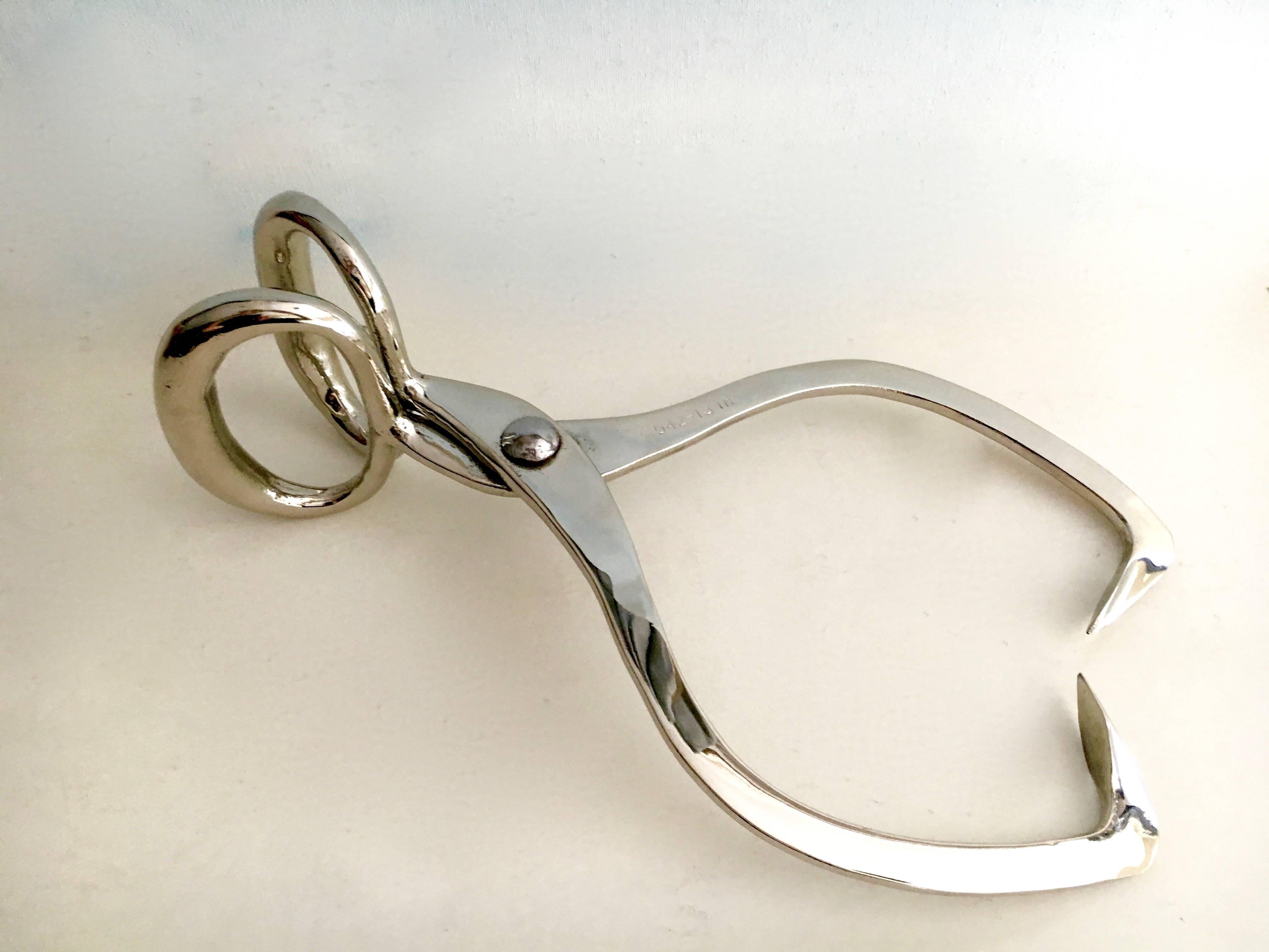 Silver plate ice tongs hay hooks, when you move your ice or pick up the hay. Be the chicest with your block!

This pair of Ice / hay tongs are a great decorative item or can be used as a paper weight.

