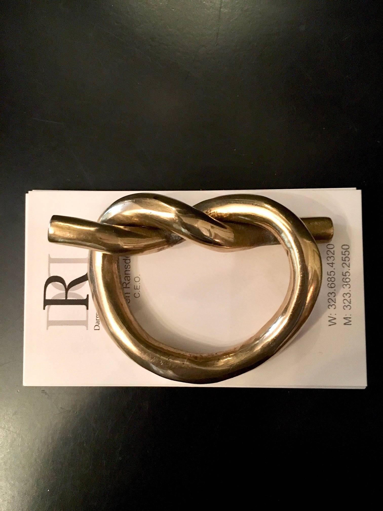 Simple and elegant - the small paper weight perfect for your tidy and functional desk. A Brass knot (or heart) ready to hold down the fort on those small things you treasure!

 