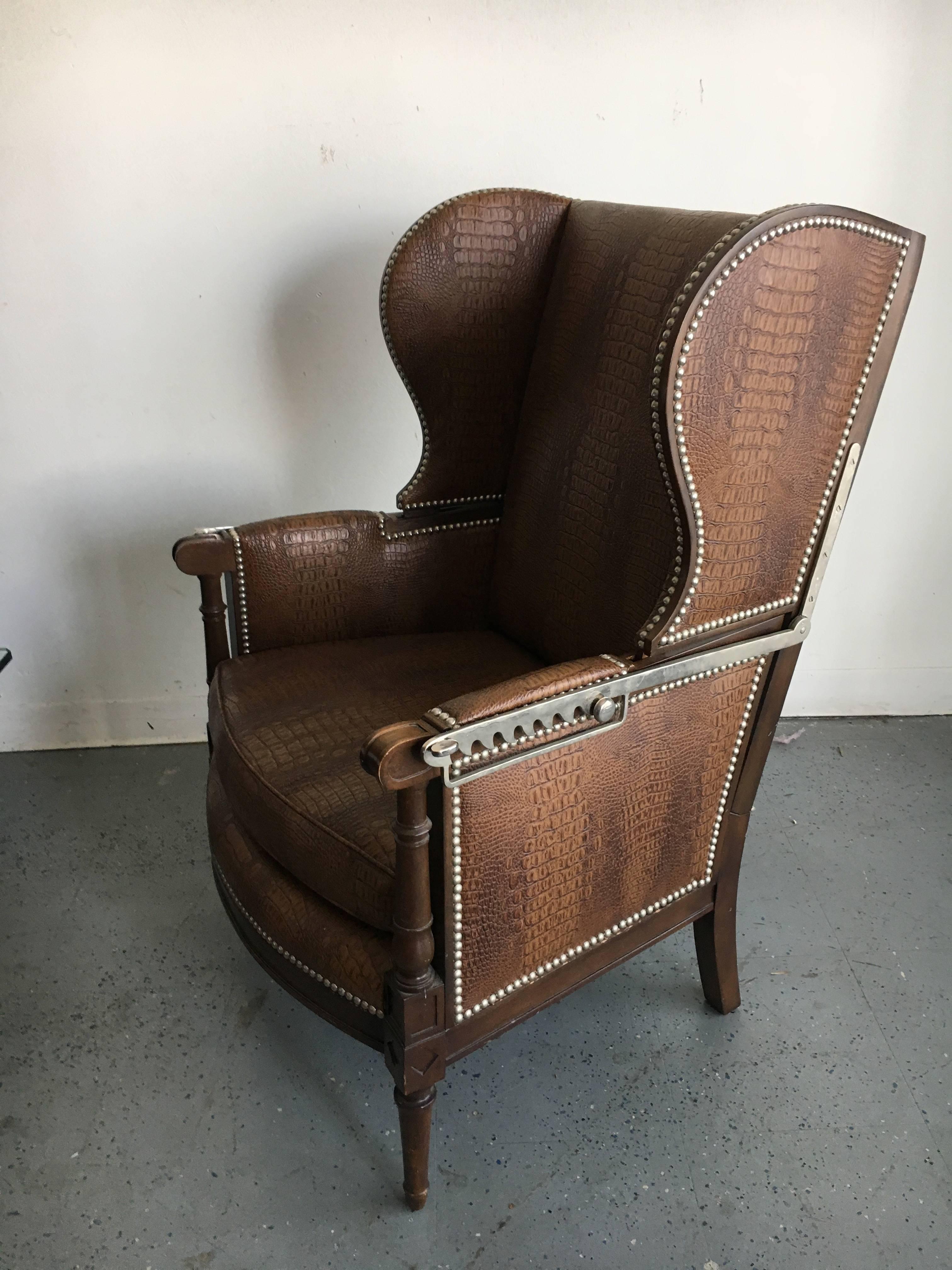 Midcentury recliner in faux crocodile, great side chair for reclining, relaxing or designing. This piece is an exceptional chair for any stylish room, a very handsome chair, newly upholstered in vinyl crocodile.  