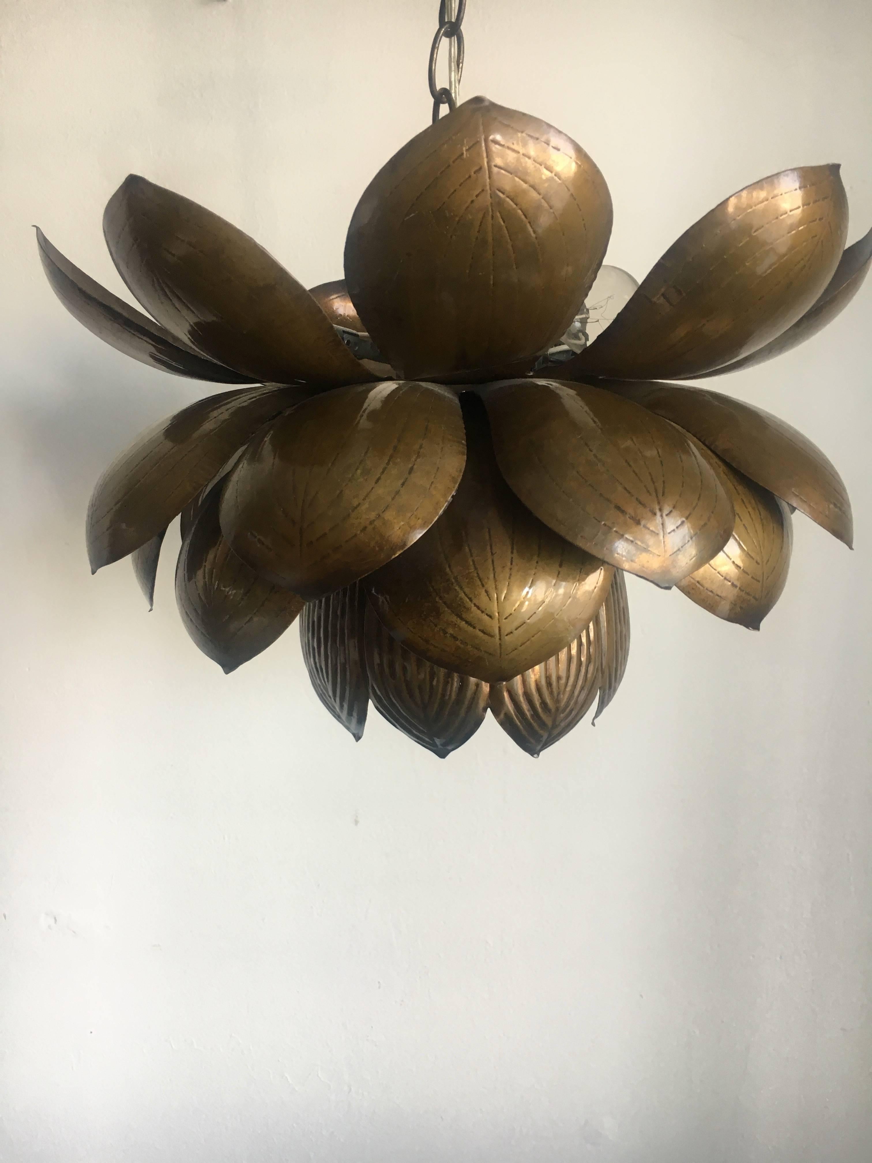 Brass Feldman Lotus lamp on a chain. We have replaced the chain on these lamps with a brass rod and they are far more elegant.