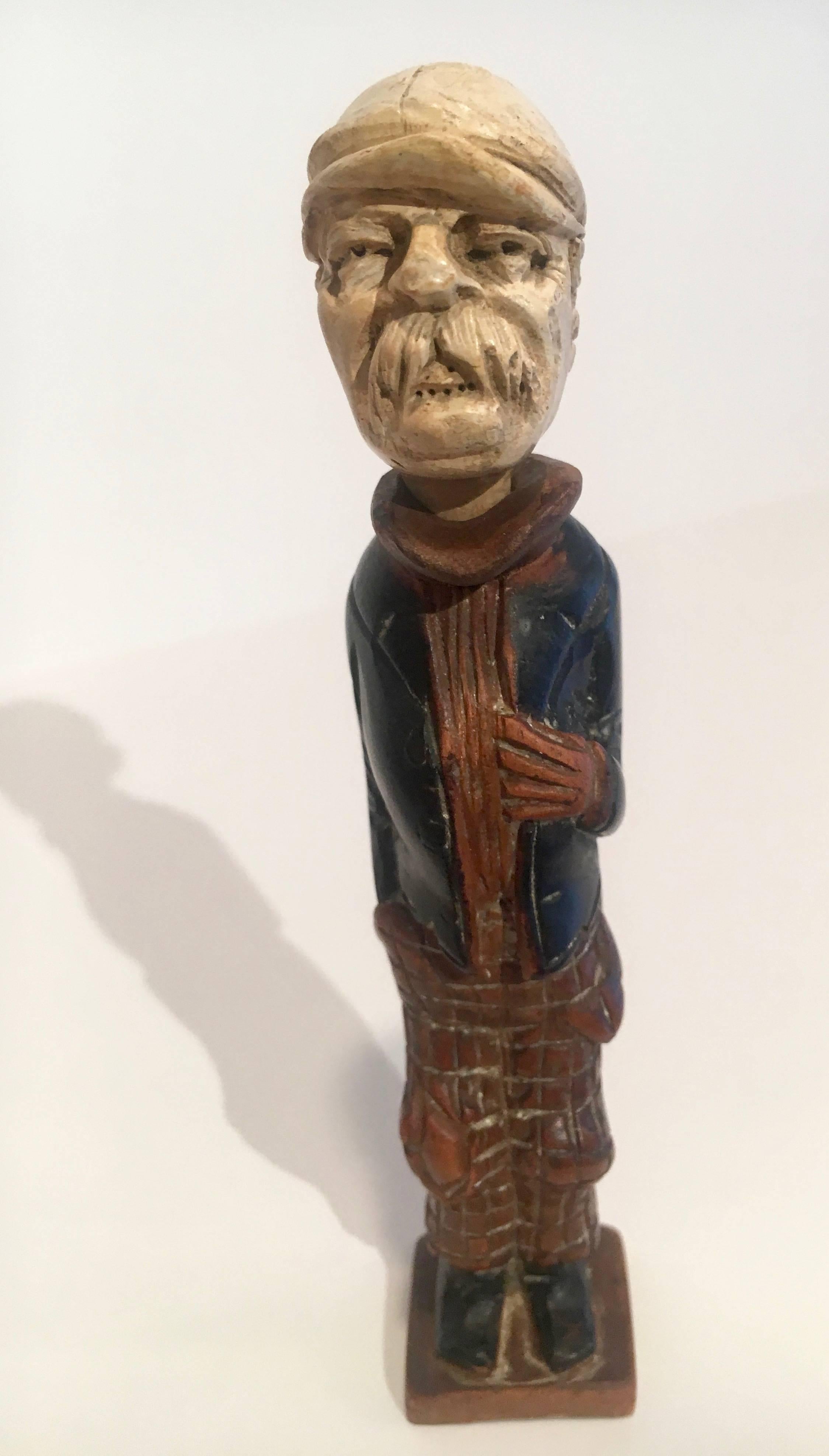 Meerschaum hand-carved male figure with Pipe head. Hand carved items. The man is wearing a long-tail suit jacket and patterned trousers. 

By removing the head portion of the man, the head becomes a pipe. Very Well detailed carving and will work