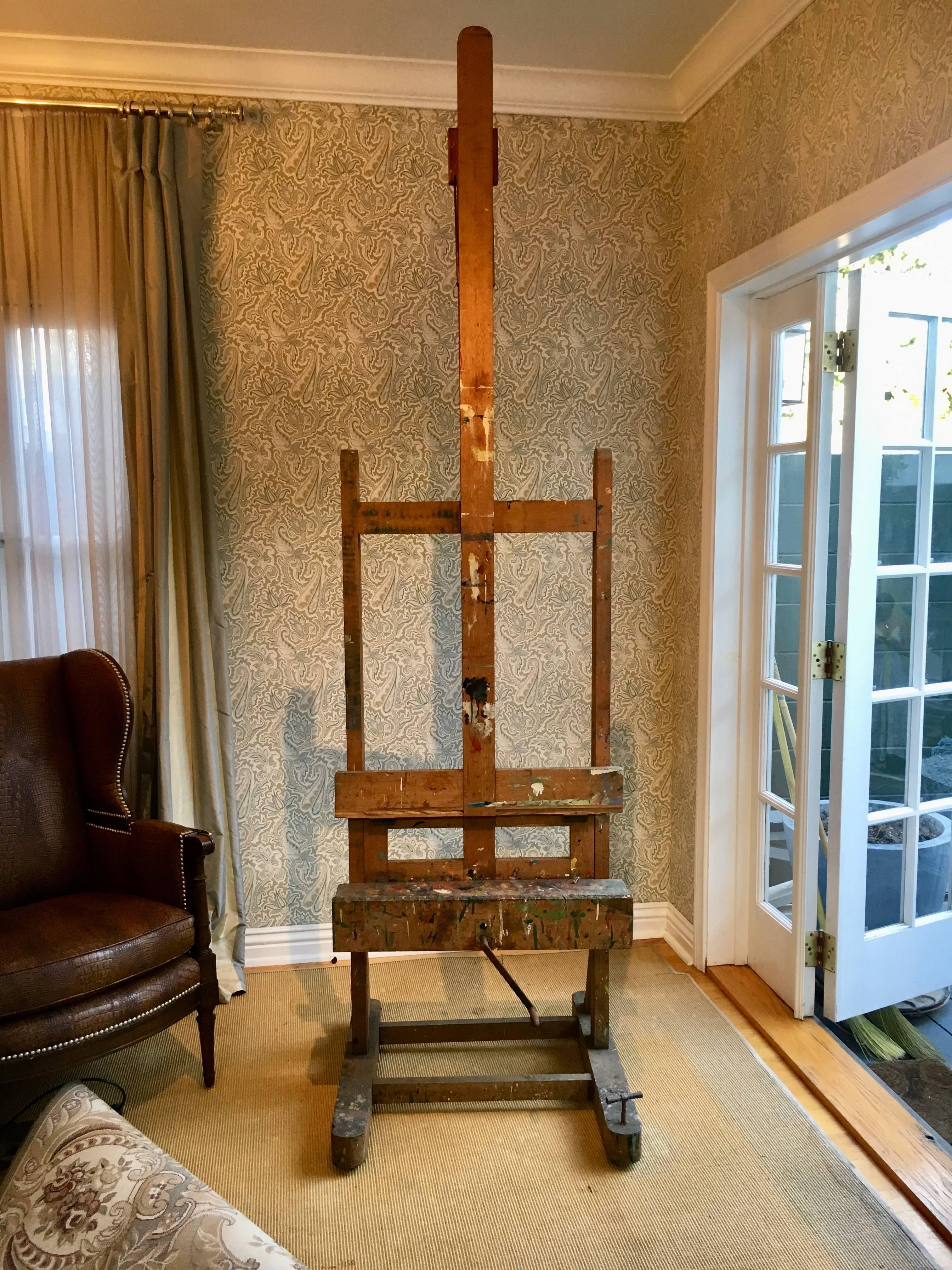 Vintage 19th Century French Wood Artists Easel - Adjustable to over 9' this easel is beautifull patinated with years of age and paint... 
The easel is a great compliment to any room with Character, will hold your canvas or art... or television.