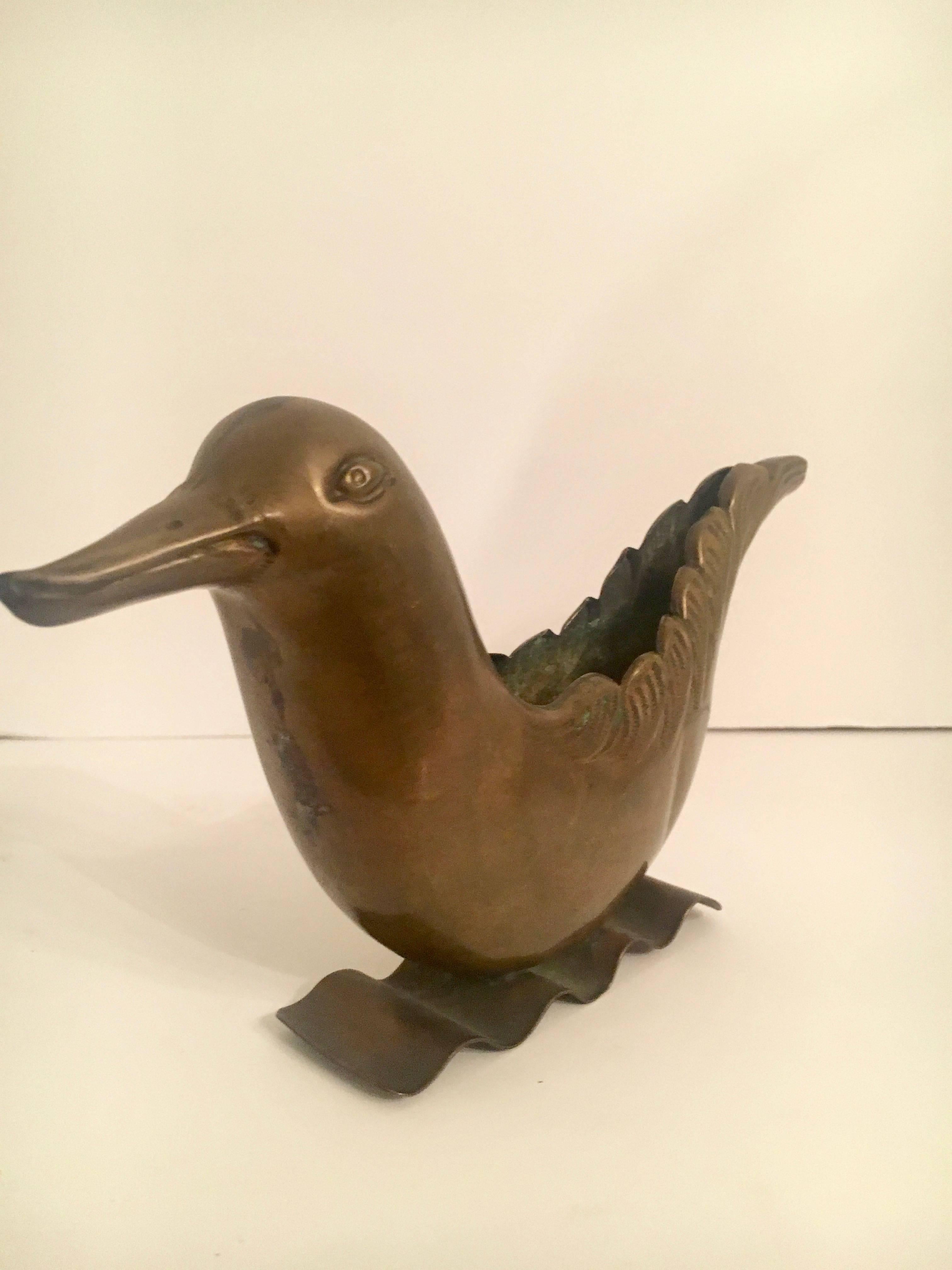 Brass Bird Urn vase - lovely decorative piece or great for small arrangements or plantings on the desk or even as a catch all for Jewelry. 

Made for the Joseph Horne Co, Although Joseph Horne stores are signs of the past, the once popular retail