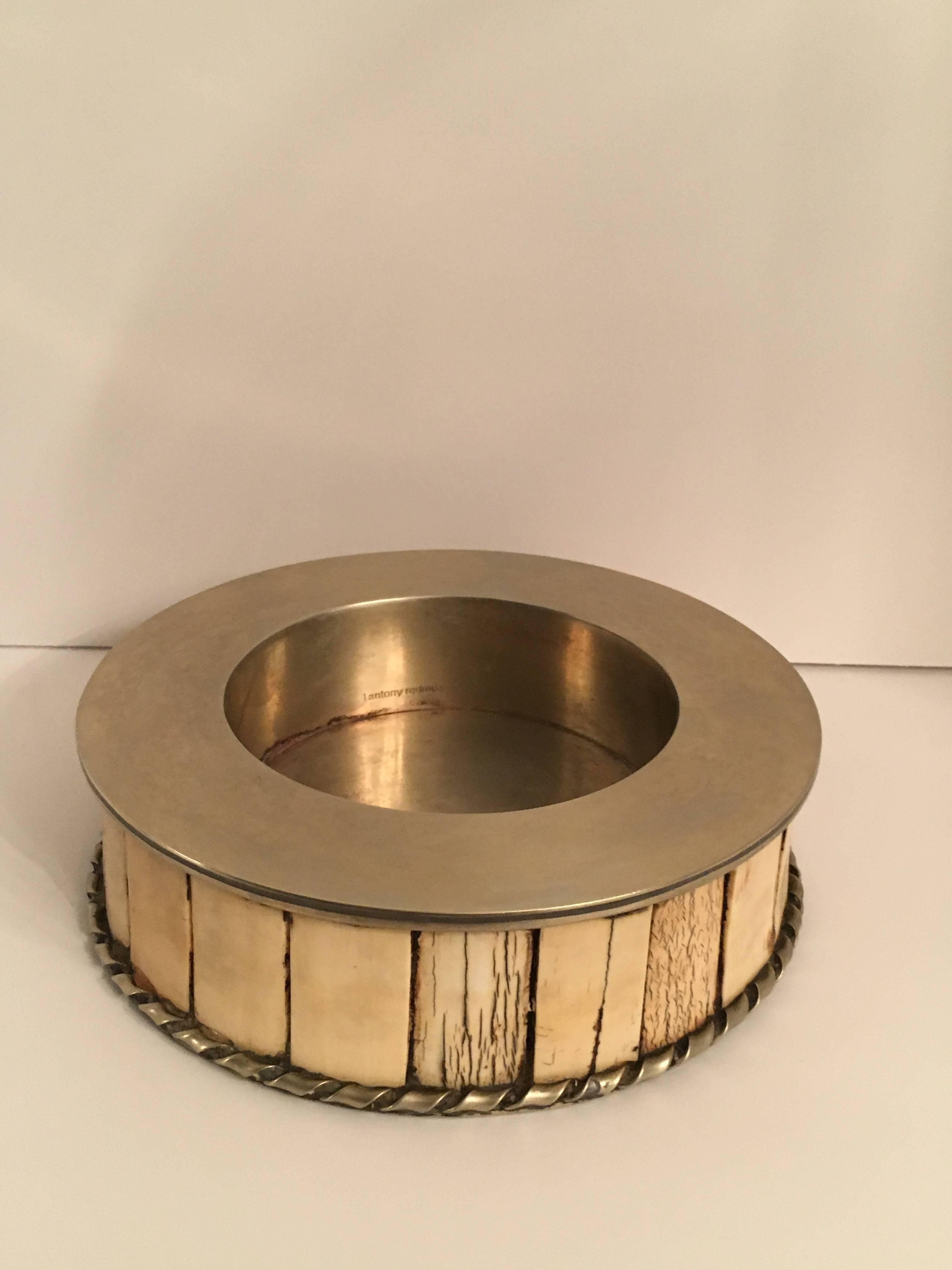 J Antony Redmile brass and bone coaster. In excellent condition, this piece works perfectly in many bar settings that display a more rustic, primitive collection, but the same great tasting Champagnes and Apertifs.