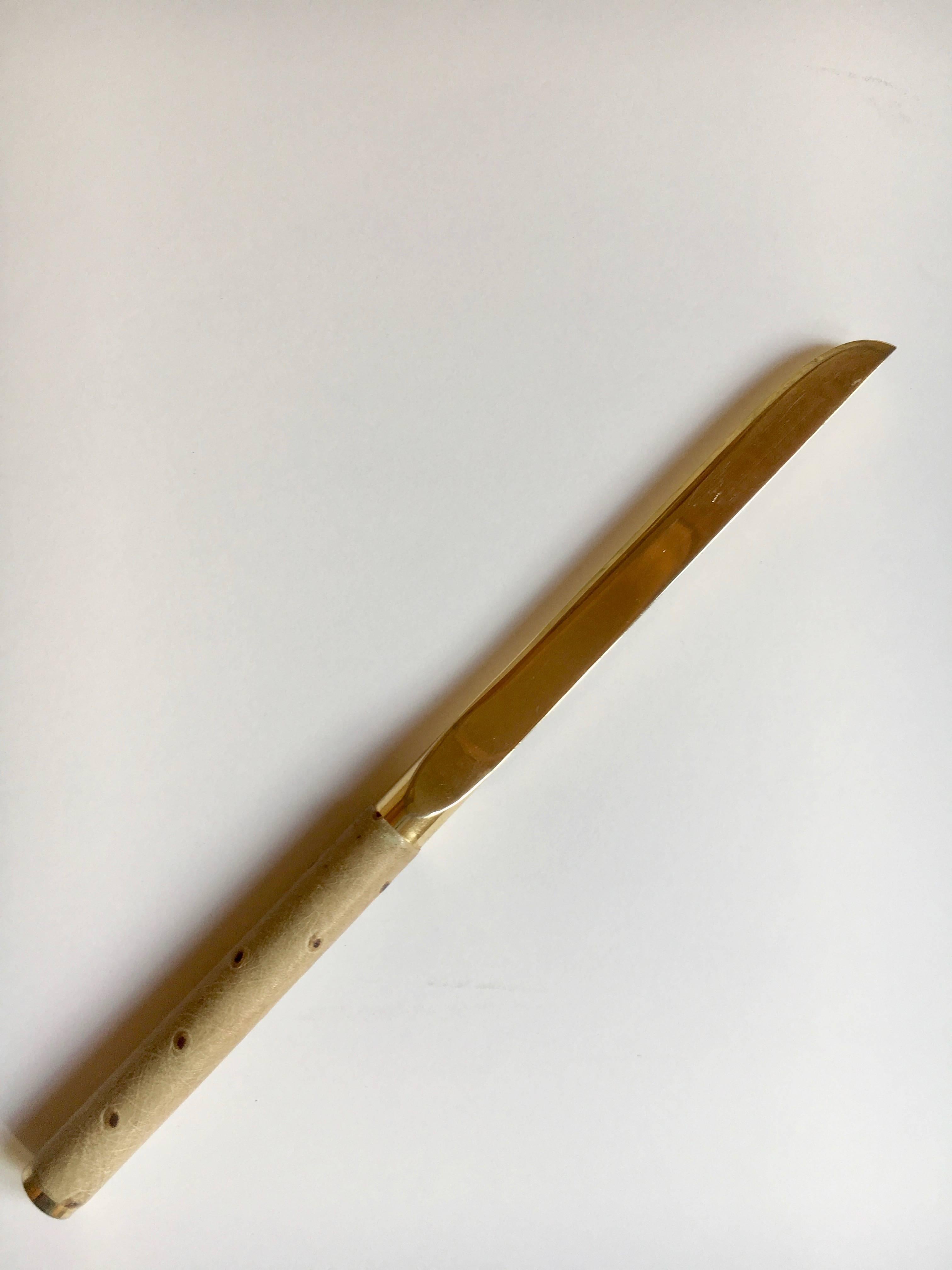 Ostrich handle letter opener with brass knife after Karl Springer. Beautifully designed, simple, elegant and functional for any desk, open letters or protect yourself!