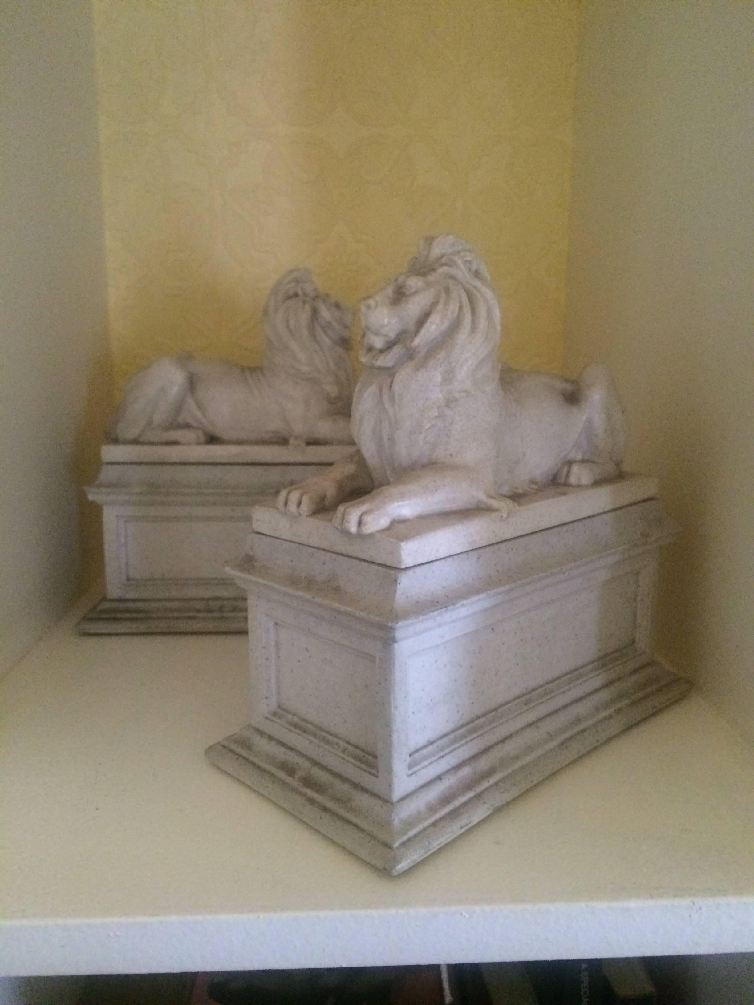 This elegant pair of seated lions are made of a resin or plaster that looks and feels like marble - adding grandeur to the library this pair can flank a seat of books or mix up the nobility in your den or study... also great for a child's reading
