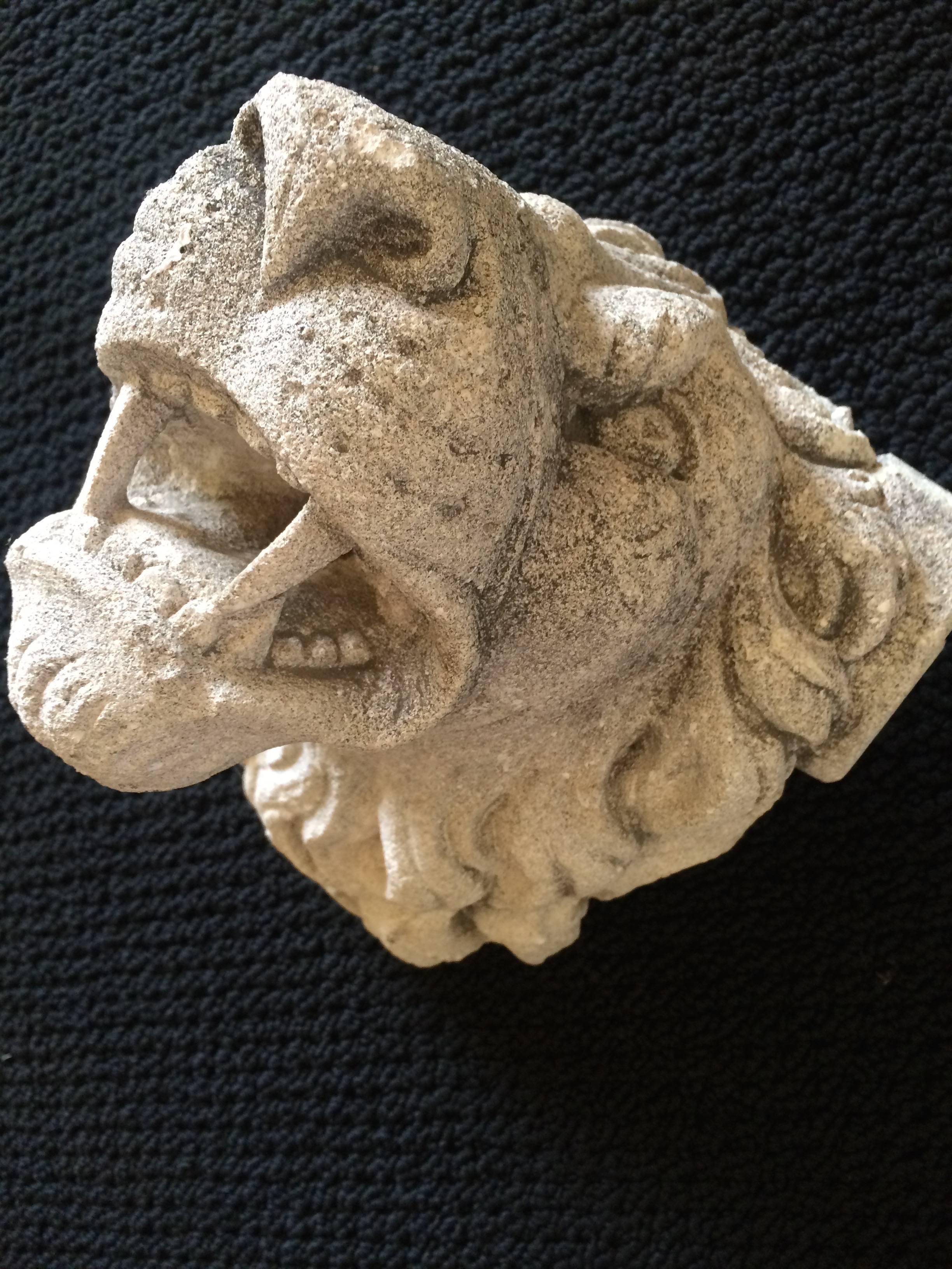 Pair of limestone lion fountain heads, the pair are slightly different and different sizes but make a lovely pair. If placed on either side of a door or large object the pair would probably not appear to be different in size each are designed