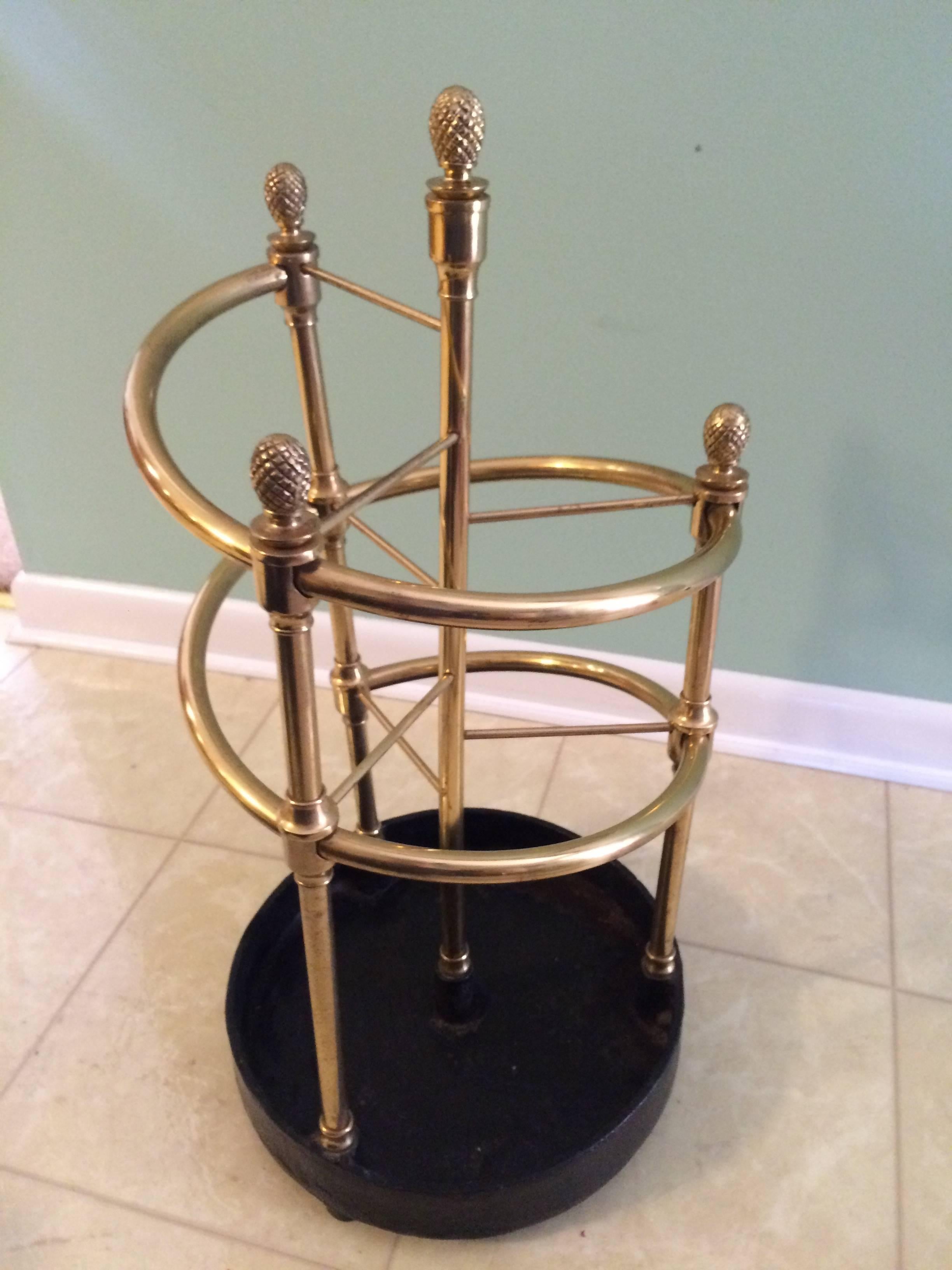 Very large brass umbrella stand spirals into three separate compartments. This is for the home with lots of umbrellas. This rare piece would also be great in a commercial space or restaurant.
