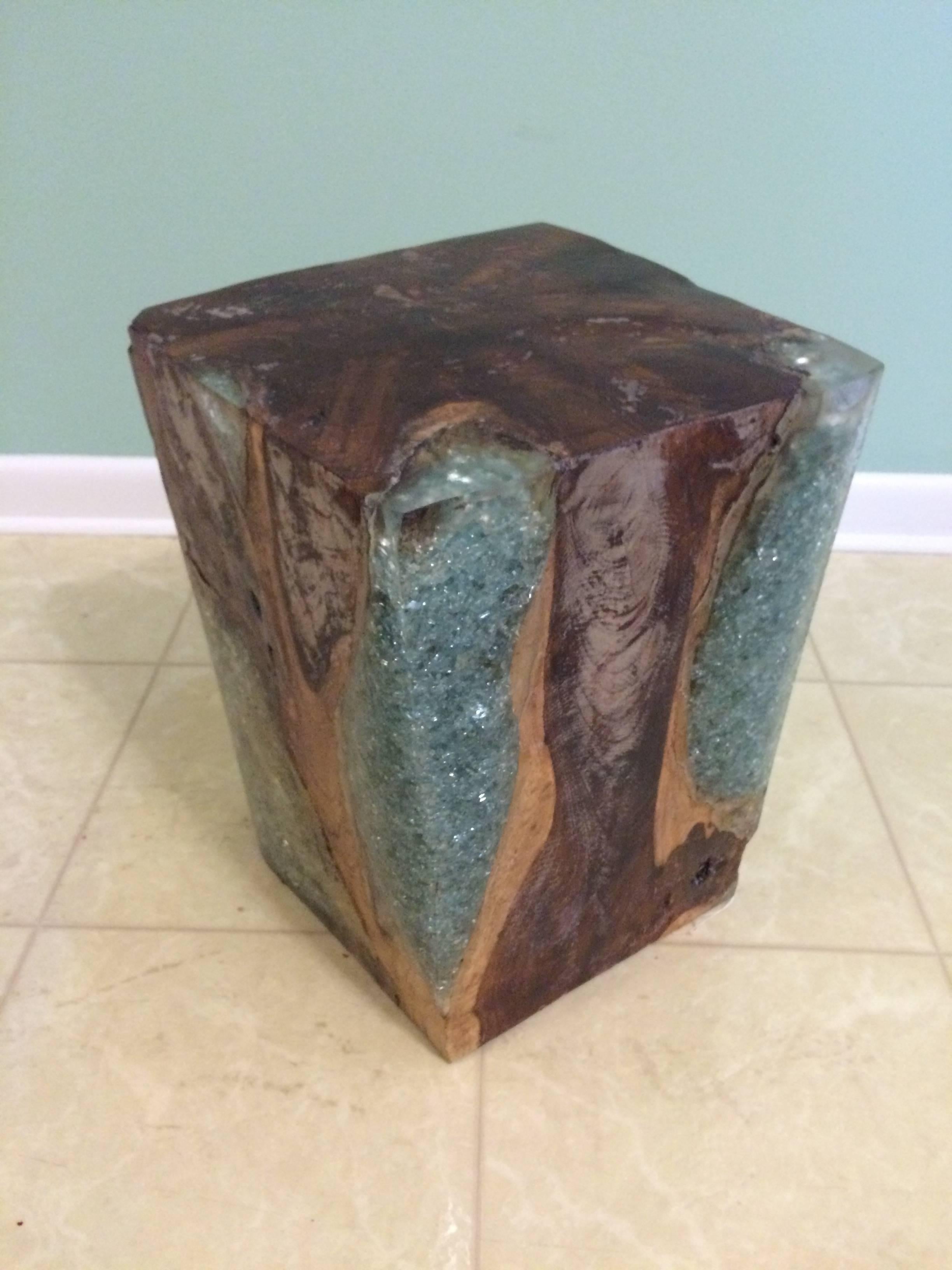 Aged wooden block with resin filling the once opened areas.