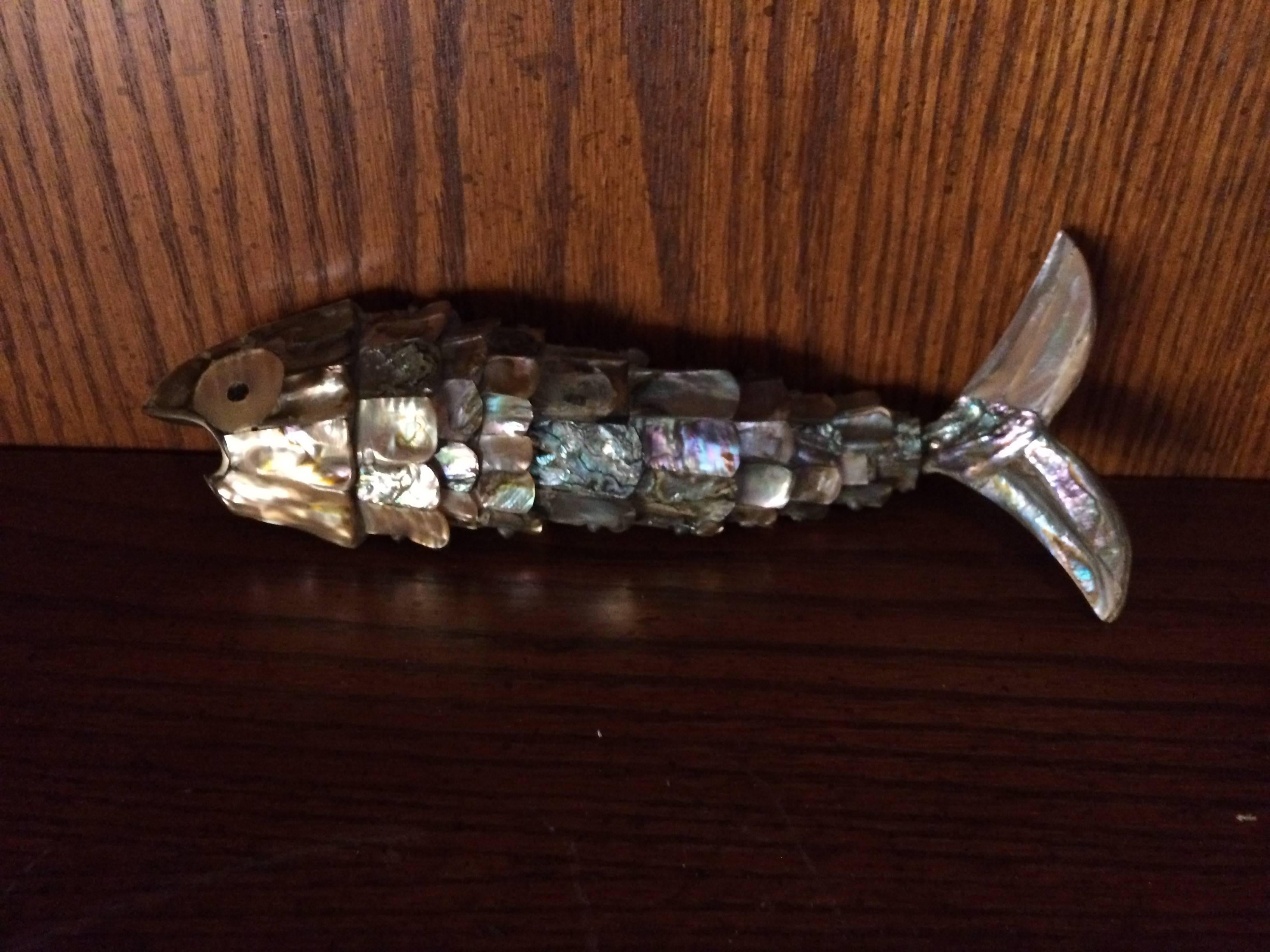 Beautiful and decorative, this abalone fish is poised and designed to open a bottle, great for the creative bartender and a great conversation piece.