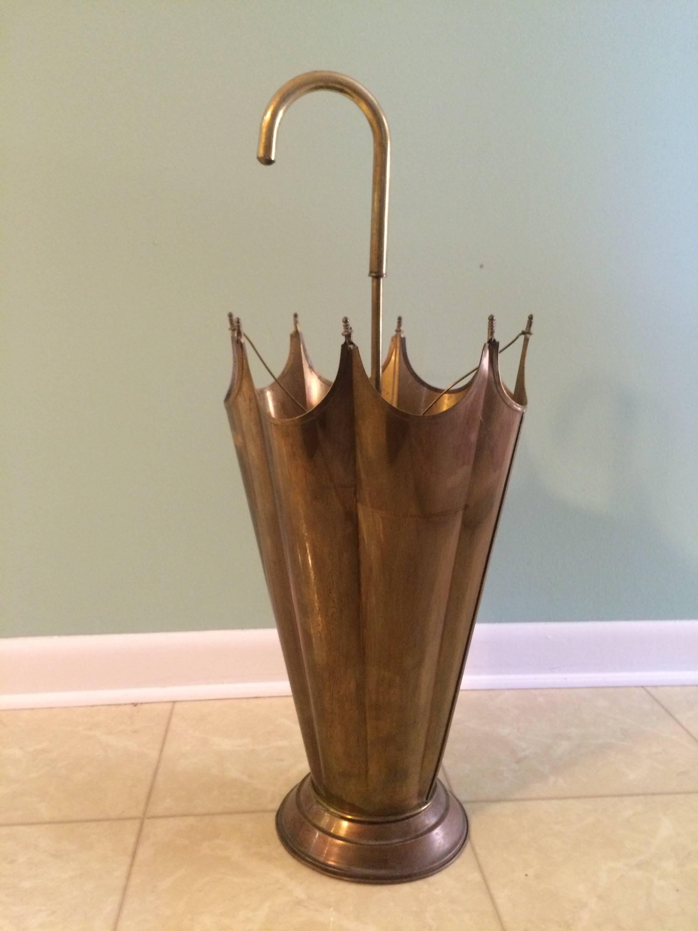 Classic French umbrella shaped umbrella stand. Patinated brass umbrella stand that mocks itself with the Classic shape - a sophisticated, conversation piece that holds the same. Great for any entry. Mary Poppins might be jealous.
