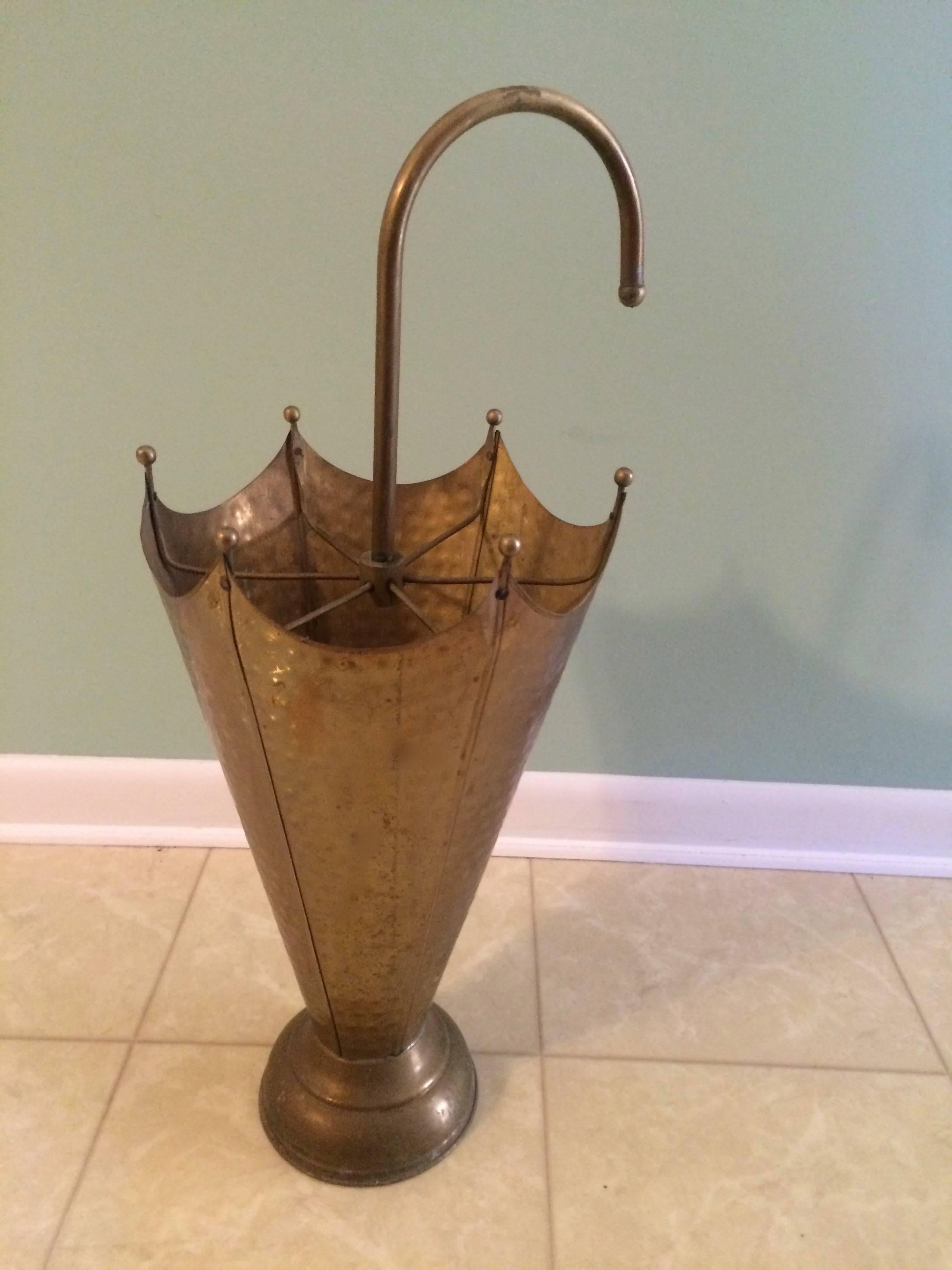Keep the water off the floor and your guests talking about this wonderful hammered brass umbrella Stand, French, circa 1940. A great piece for any entry or conversation.