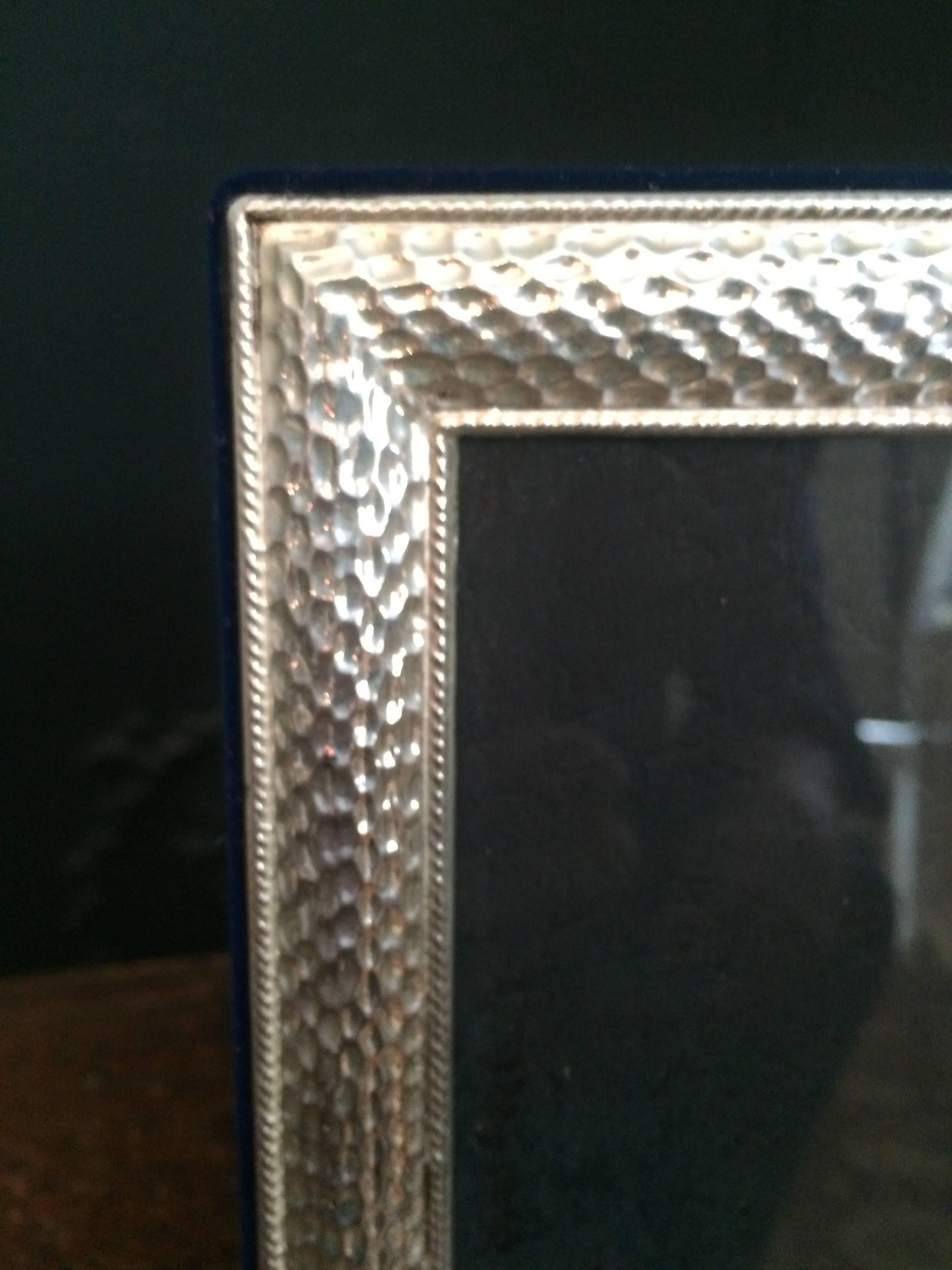 5 x 7 sterling frame with beautiful detailed edge. The side and rear are a royal blue velvet. Perfect to display that special someone.
