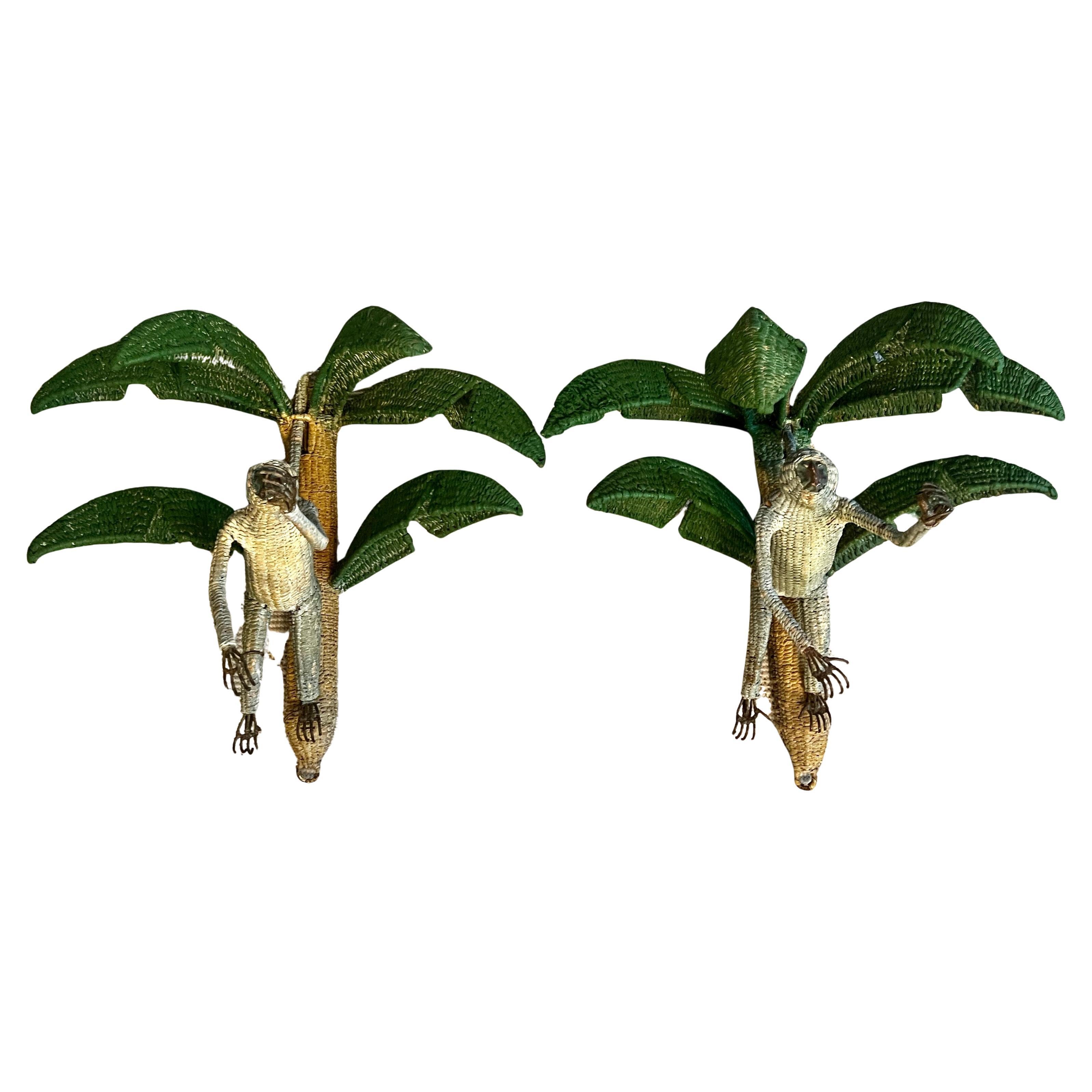 Pair of Rattan Monkey's on a Palm Tree, Attributed to Mario Lopez Torres.

The pair are wonderful flanking a doorway or entry way and especially great in a home near the water or a  tropical themed space.

Mario Lopez Torres is an Iconic Mexican