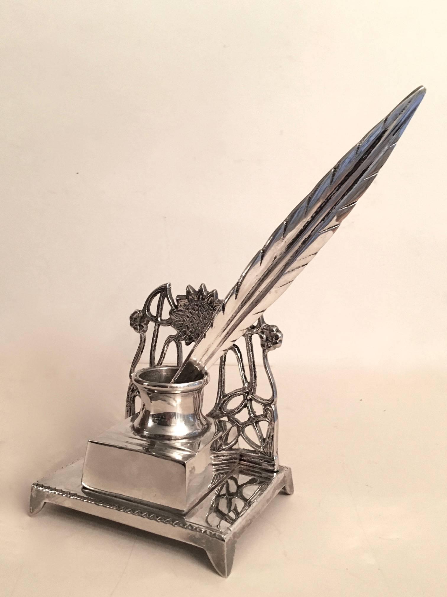 Very unique and rare French Art Nouveau silver plate ink well with silver plate feather. A beautiful and unique ink well making a great impression on any desk or writing area. The unique feather Quill is a large and substantial letter