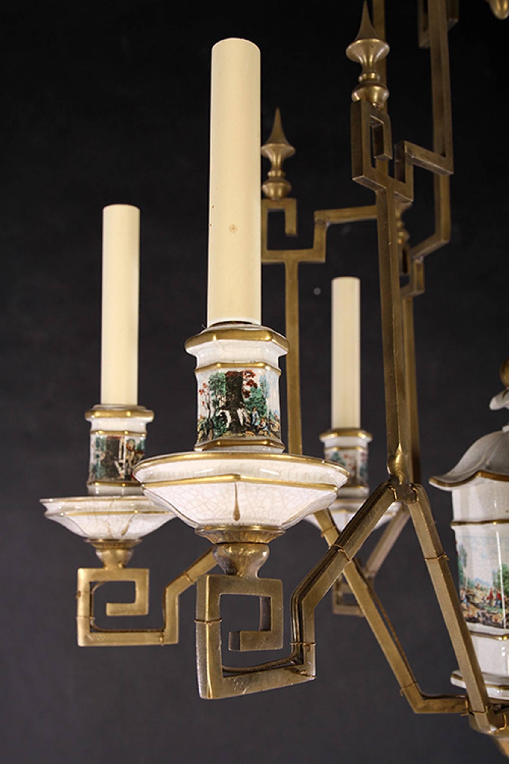 An early 20th Century French pagoda style six light bronze chandelier with transfer decoration on porcelain accents. Unique and beautiful, in the manner of Madeline Castaing.