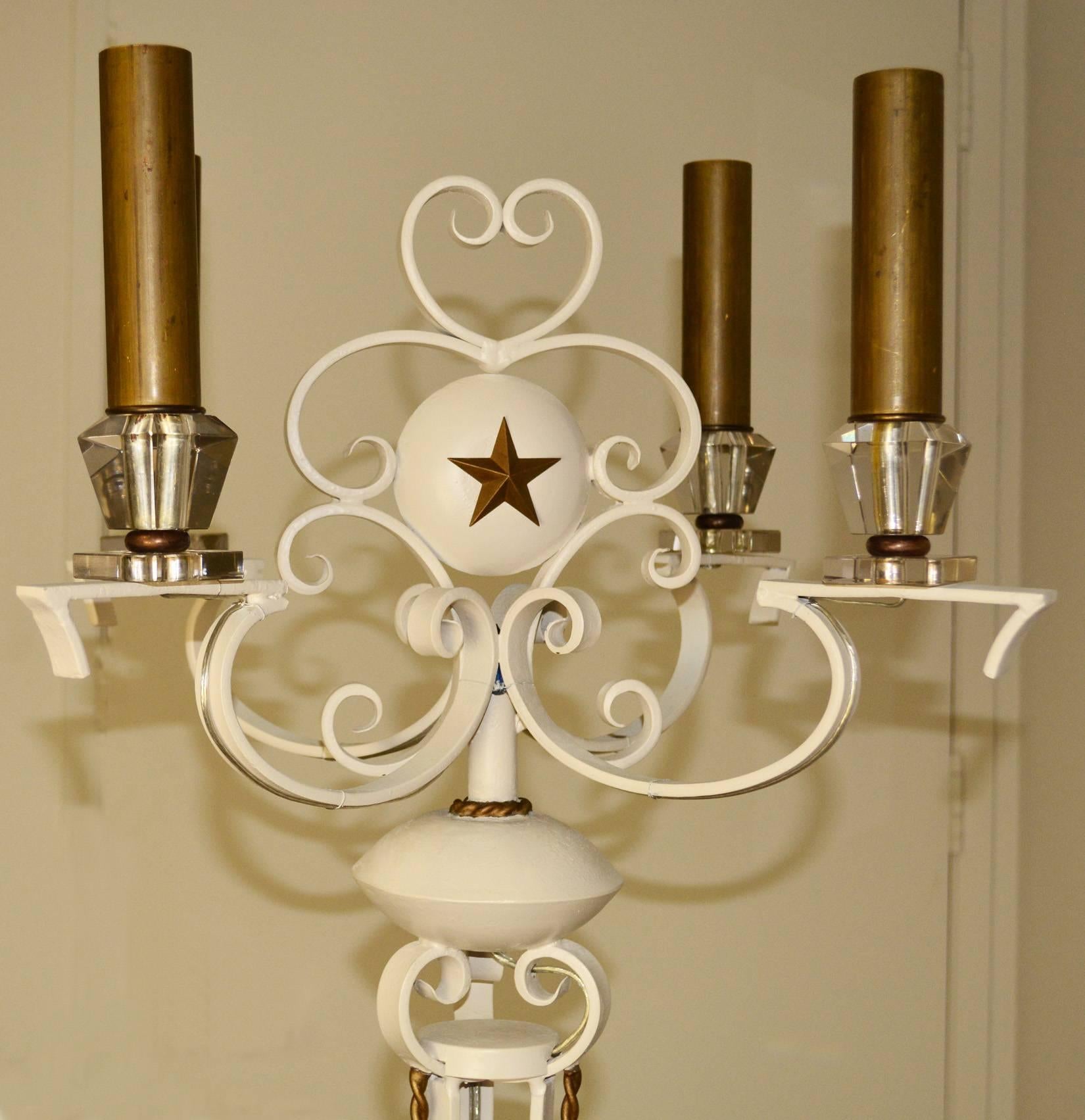 Vintage painted wrought iron floor lamp in the style of Arlus with gold painted twist detailing and four crystal bobeche and candle holders. Perfect for an interior inspired by the French Riviera, Arbus, Jansen, Royere. 
