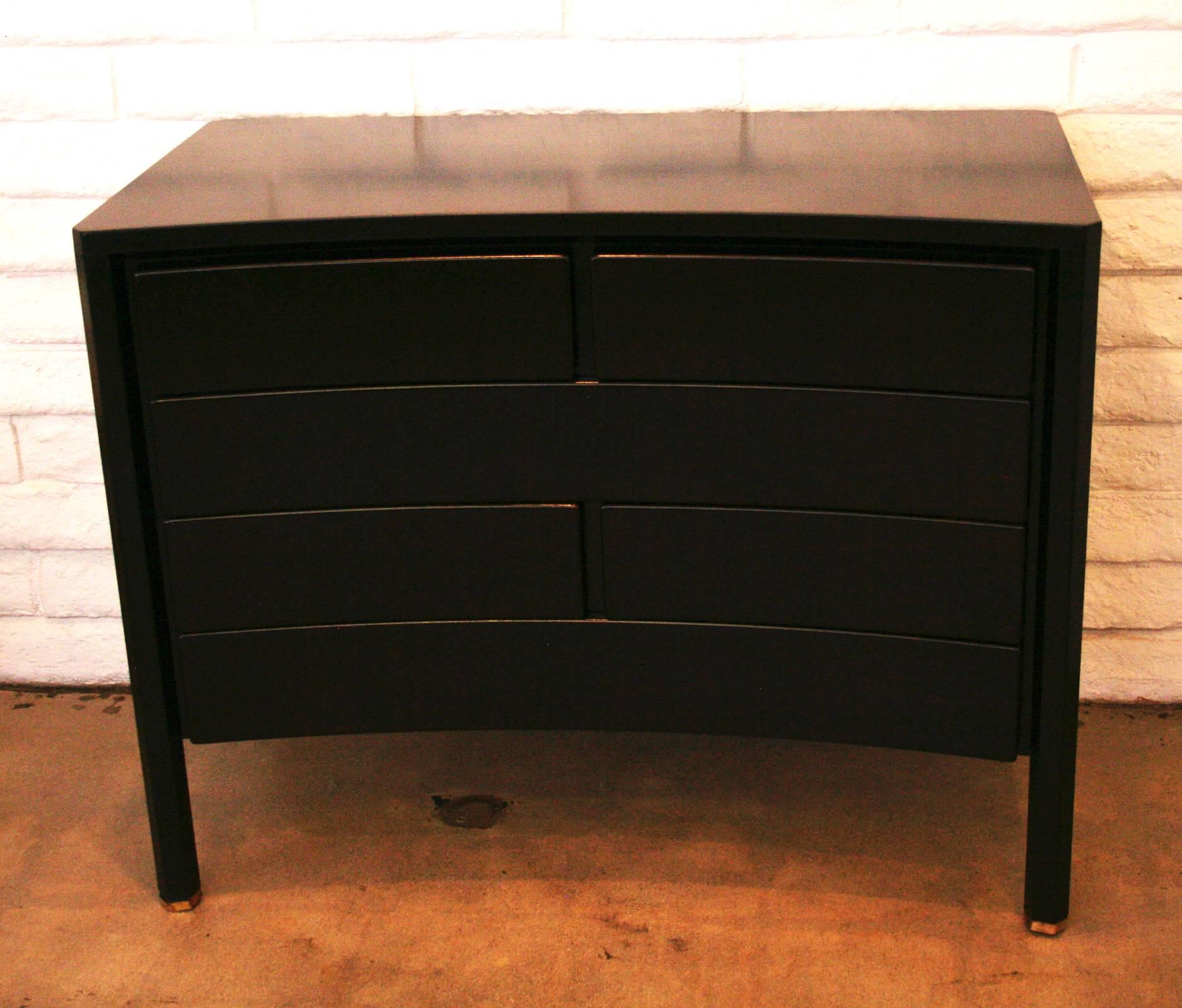 Very sculptural chest of drawers in ebonized mahogany by Edmond Spence (often misspelled as "Edmund Spence"), circa 1955. Concave front with hexagonal legs with brass sabot. Exceptional.