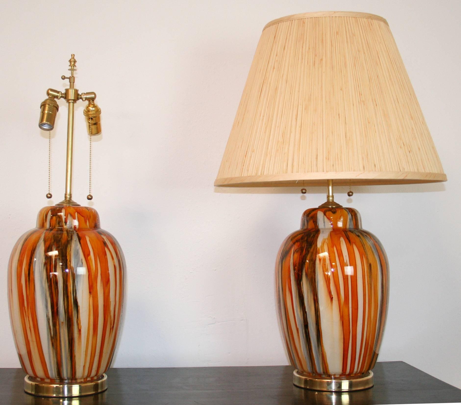 A pair of 1980s Italian glass lamps in cream, orange and brown. Rewired with new double cluster sockets. Shades for display only. Mid-Century Modern style.