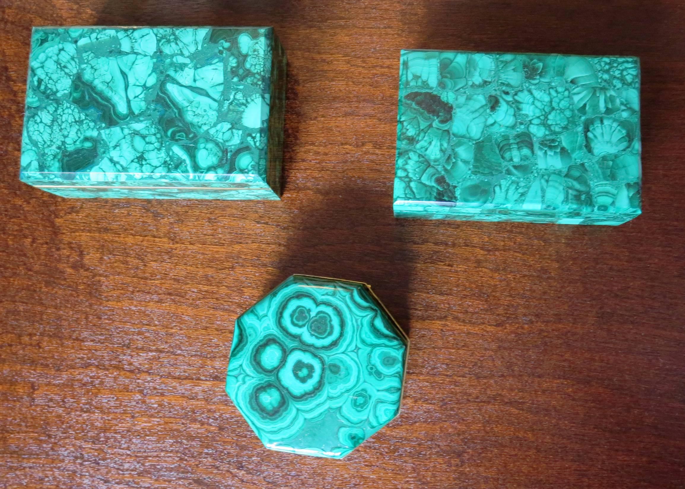 A set of three vintage malachite boxes, two rectangular boxes with conforming lids and one octagonal box with a hinged, brass banded lid. Beautiful color and pattern.