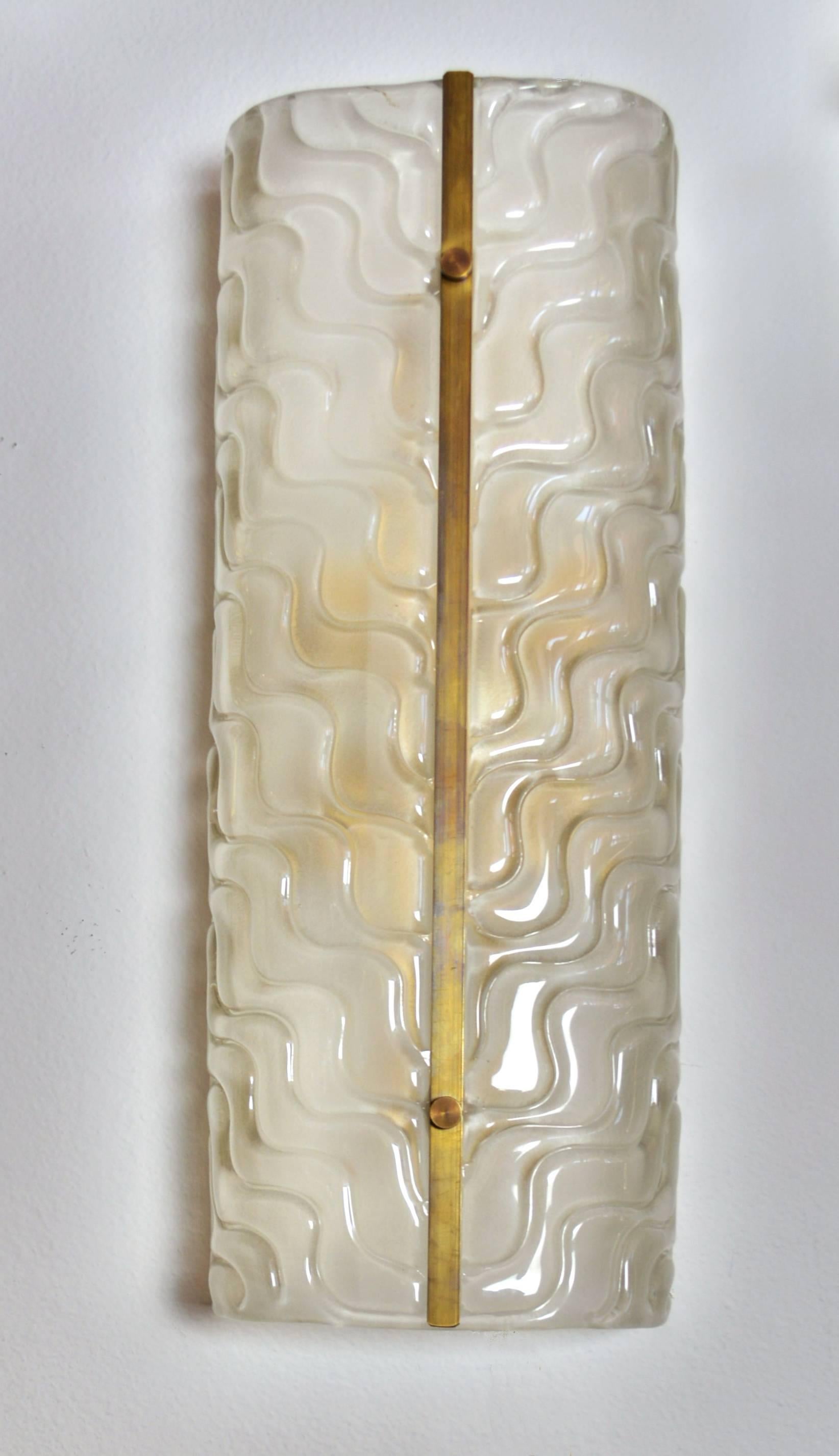 A pair of very large Mid-Century Modern wall sconces by Barovier of textured Murano glass. Each demilune shaped piece of glass held onto a painted steel superstructure by a brass band and fasteners. With four candelabra base sockets.