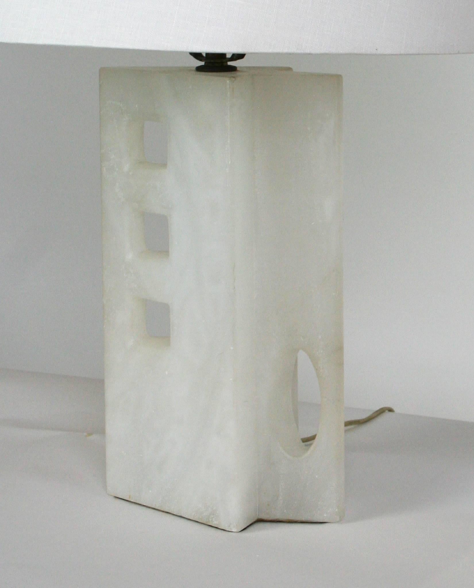 Mid-Century Modern alabaster lamp. Arrow shaped with three square cutouts and an oval cutout. Lamp shade for display only. 
